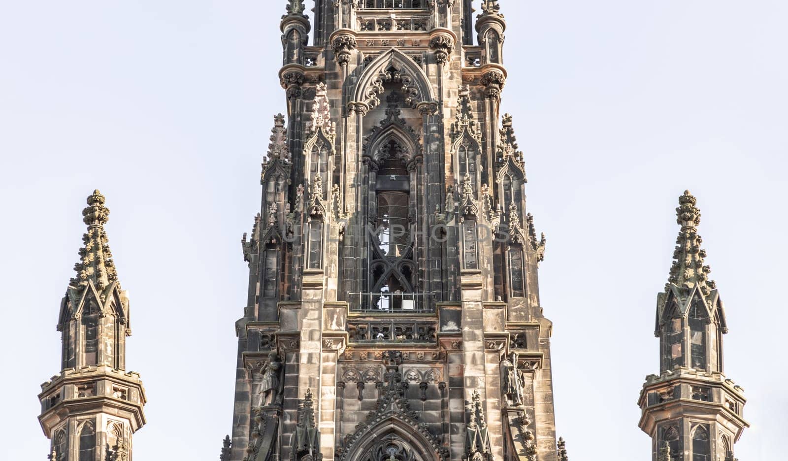 Edinburgh, Scotland - Jan 16, 2024 - The architectural details of The Scott Monument and spire is a Victorian Gothic monument to Sir Walter Scott. It is the largest monument to a writer in Princes Street Gardens at the city of Edinburgh. Space for text, Selective focus.