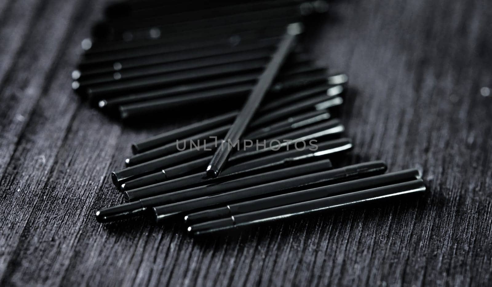 nibs for drawing tablet pen on a dark table, close up view