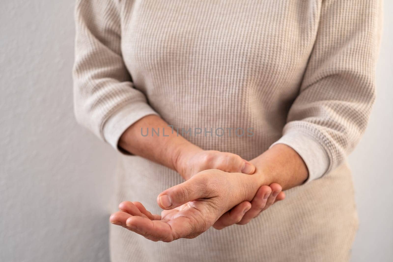 Female old hand measure check arm pulse. Elderly woman heart health.