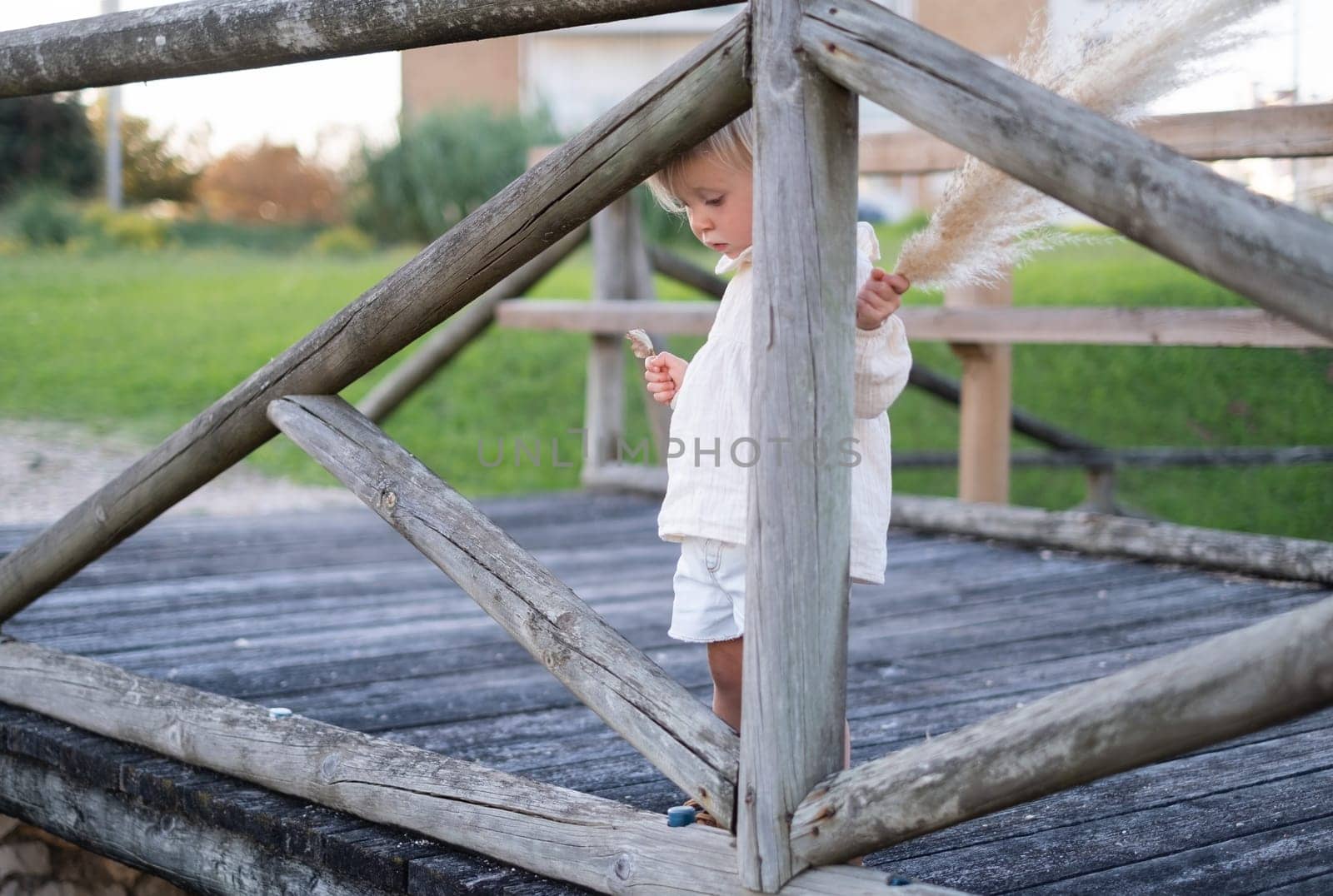 Beautiful little caucasian girl walking outdoor feeling alone and sad