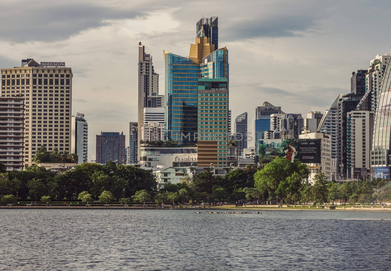 Bangkok, Thailand - 22 Jun, 2024 - Cityscape office buildings with modern architecture. Picturesque view of skyscrapers and dramatic sky before sunset, Copy space, Selective focus.
