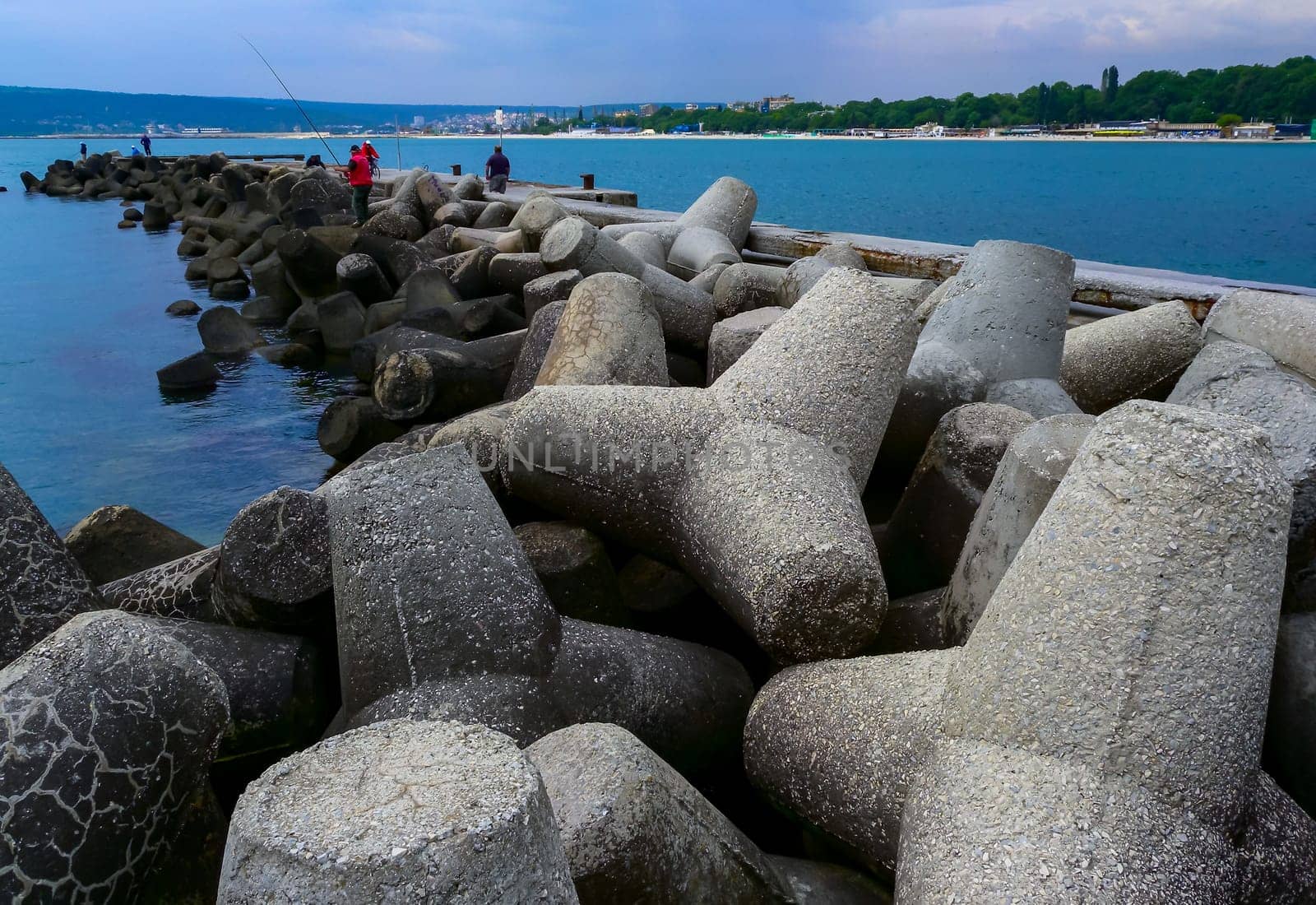 BULGARIA, VARNA - JUNE 06, 2013: coast protection structures, pier and concrete tetrahedrons for storm protection and pier destruction, Bulgaria