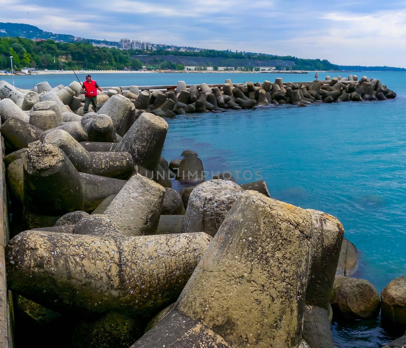BULGARIA, VARNA - JUNE 06, 2013: coast protection structures, pier and concrete tetrahedrons for storm protection and pier destruction, Bulgaria