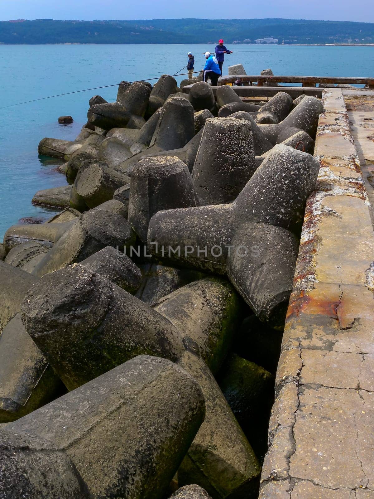 BULGARIA, VARNA - JUNE 06, 2013: coast protection structures, pier and concrete tetrahedrons for storm protection and pier destruction, Bulgaria