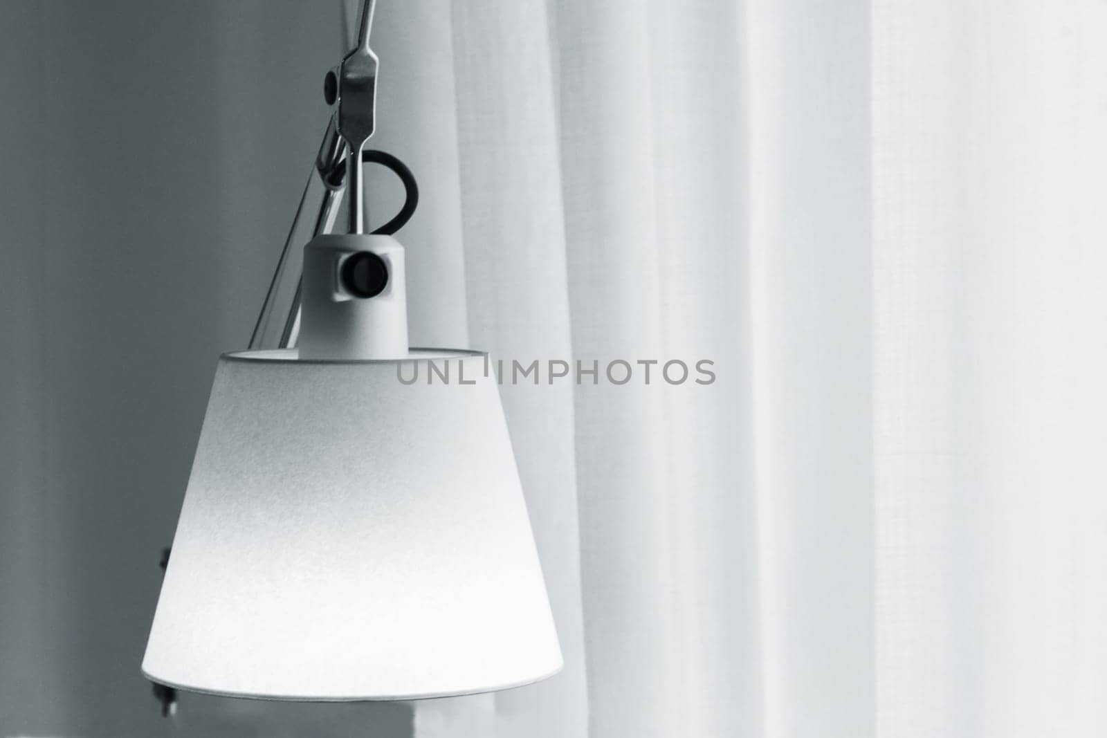 Vintage table lamp Interior design idea opposite the curtains in the backlight from the window. Minimalist interior idea.