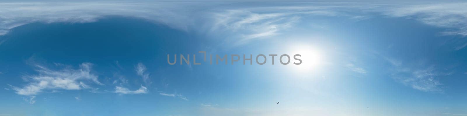 Bright sunset sky panorama with Cirrus clouds. Seamless hdr spherical equirectangular 360 panorama. Sky dome or zenith for 3D visualization, game and sky replacement for aerial drone 360 panoramas.