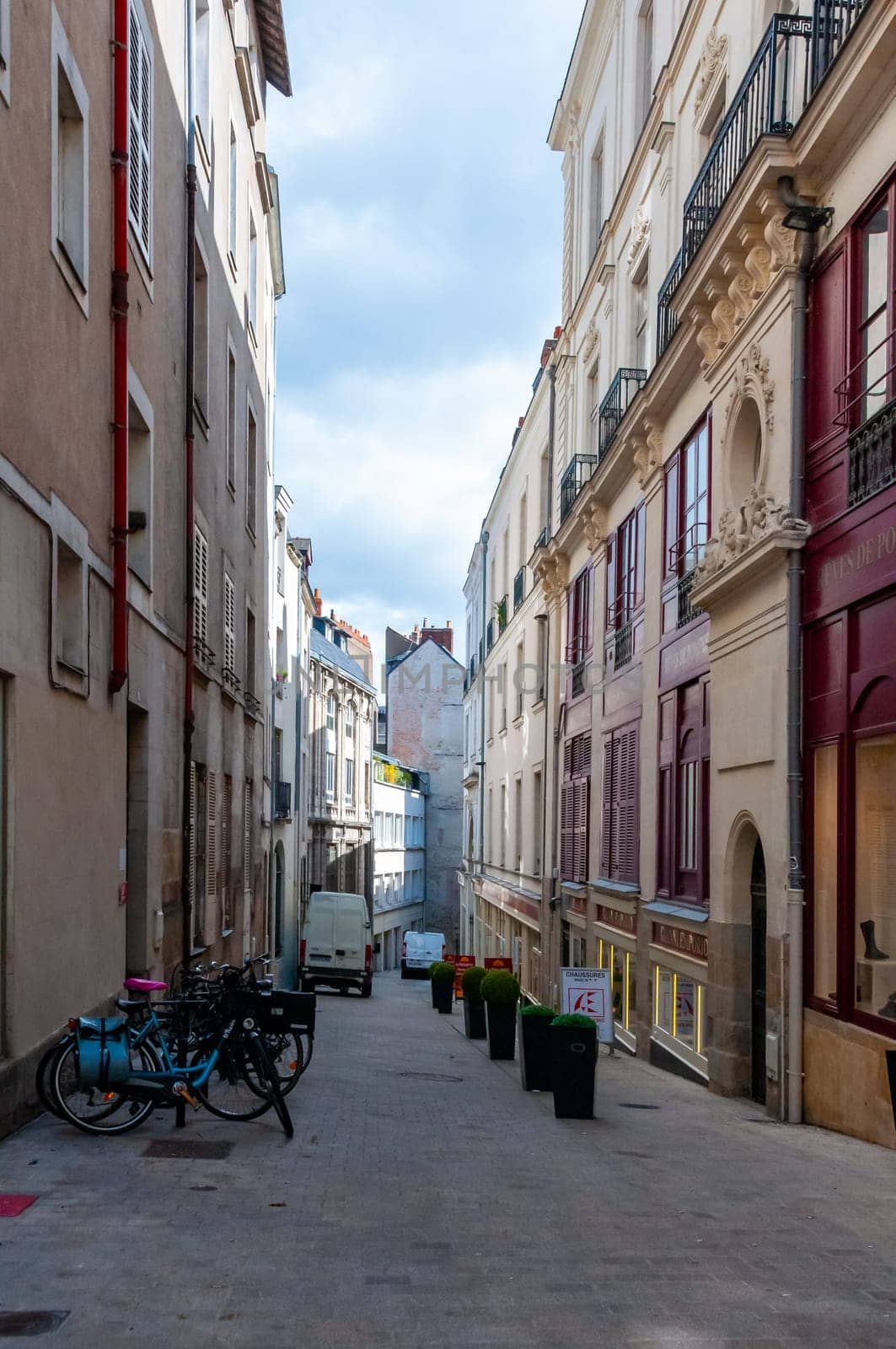NANTES, FRANCE - SEPTEMBER 12, 2017: cityscape, cobblestone streets among old houses in downtown Nantes, France