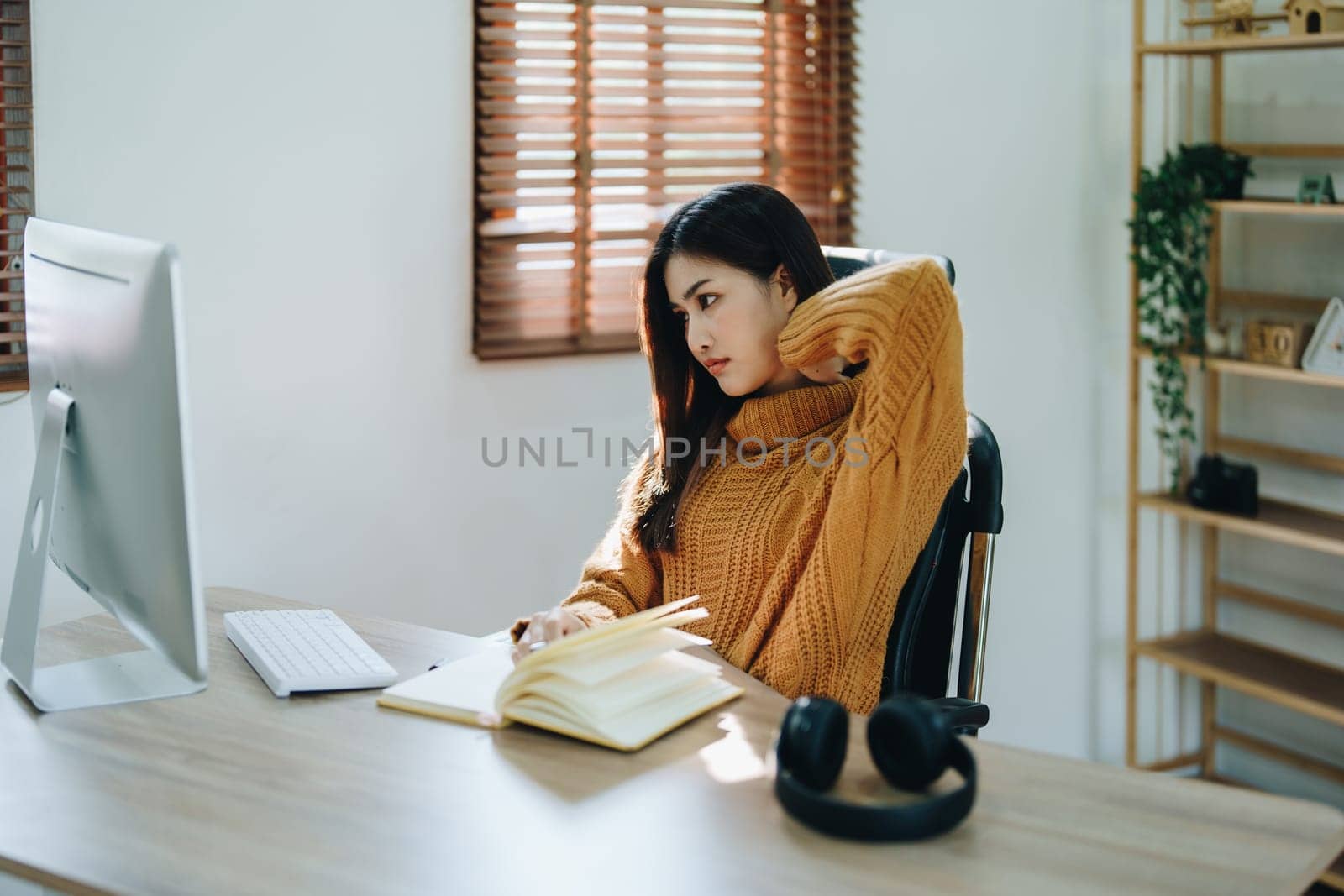 Portrait of business owner, woman using computer and financial statements Anxious expression on expanding the market to increase the ability to invest in business by Manastrong