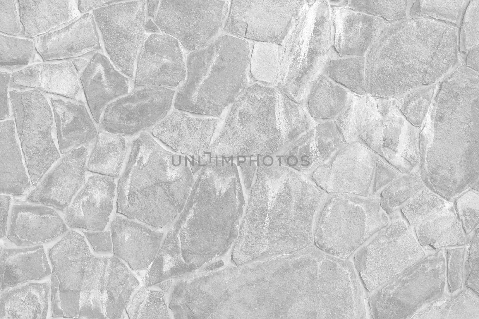 Old stone wall in light grey tonality. Abstract background and texture.