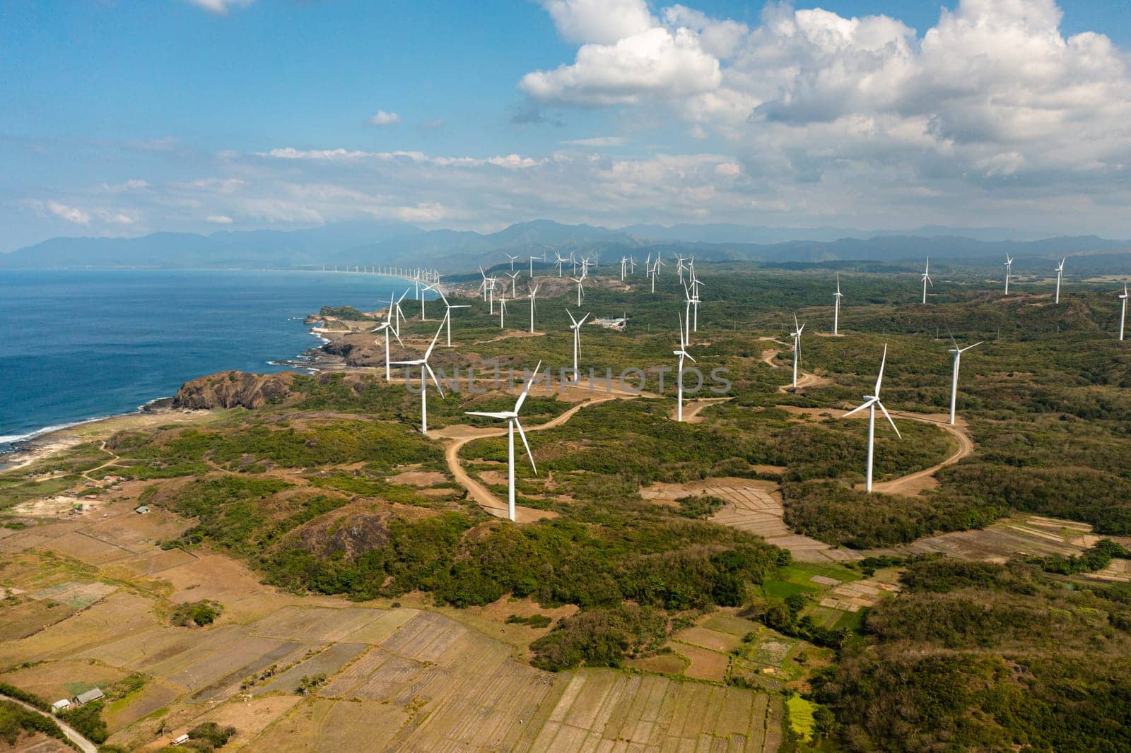 Group of windmills for renewable electric energy production. Wind Power Station. Philippines.