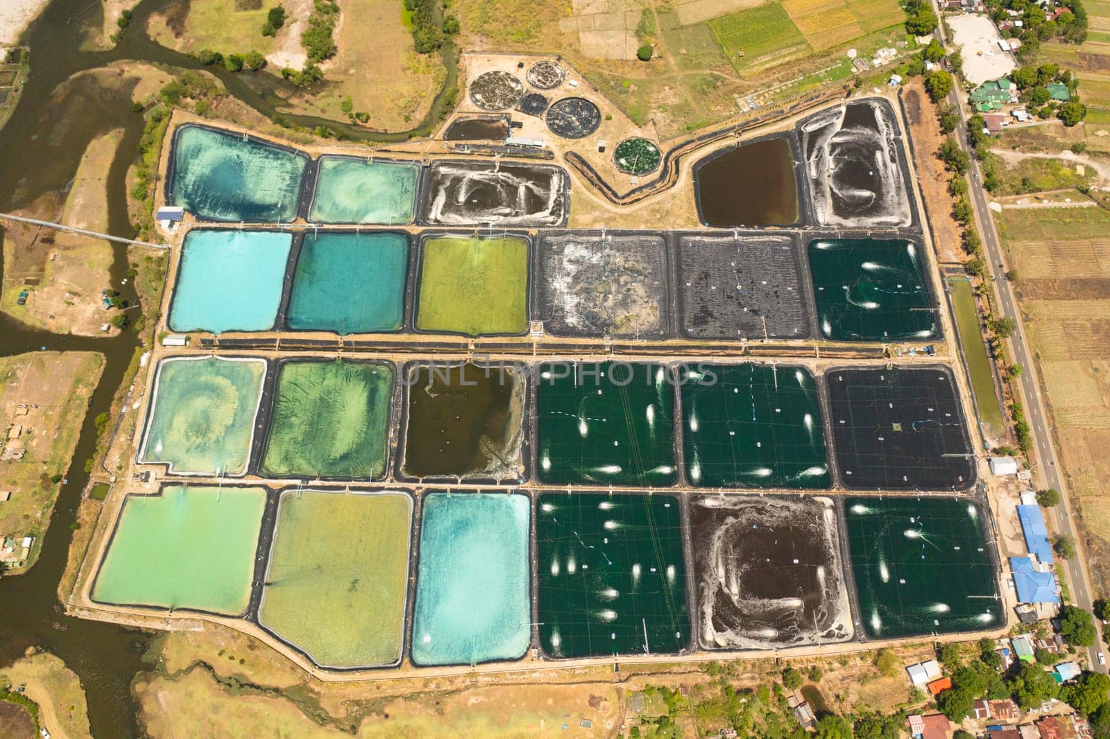 Aerial drone of Pump ponds at a shrimp farm in the Philippines.Prawn farm with aerator pump.