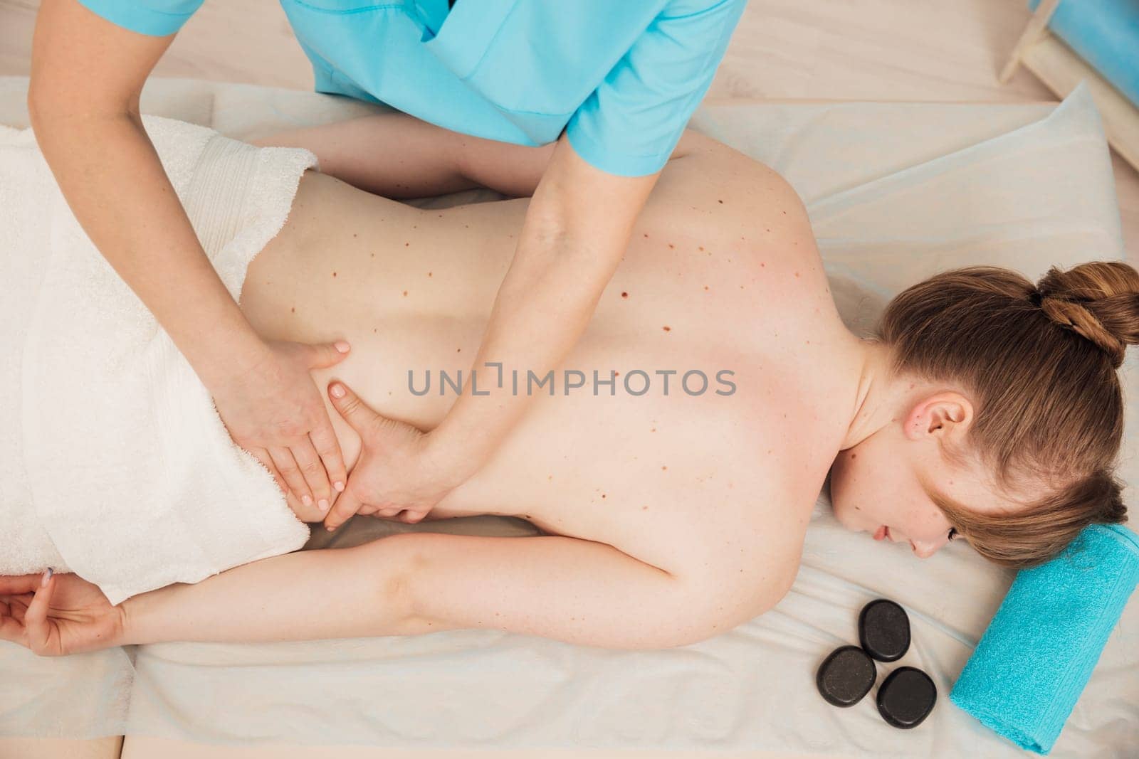 back massage in the office crepatura osteopathy relaxation stones