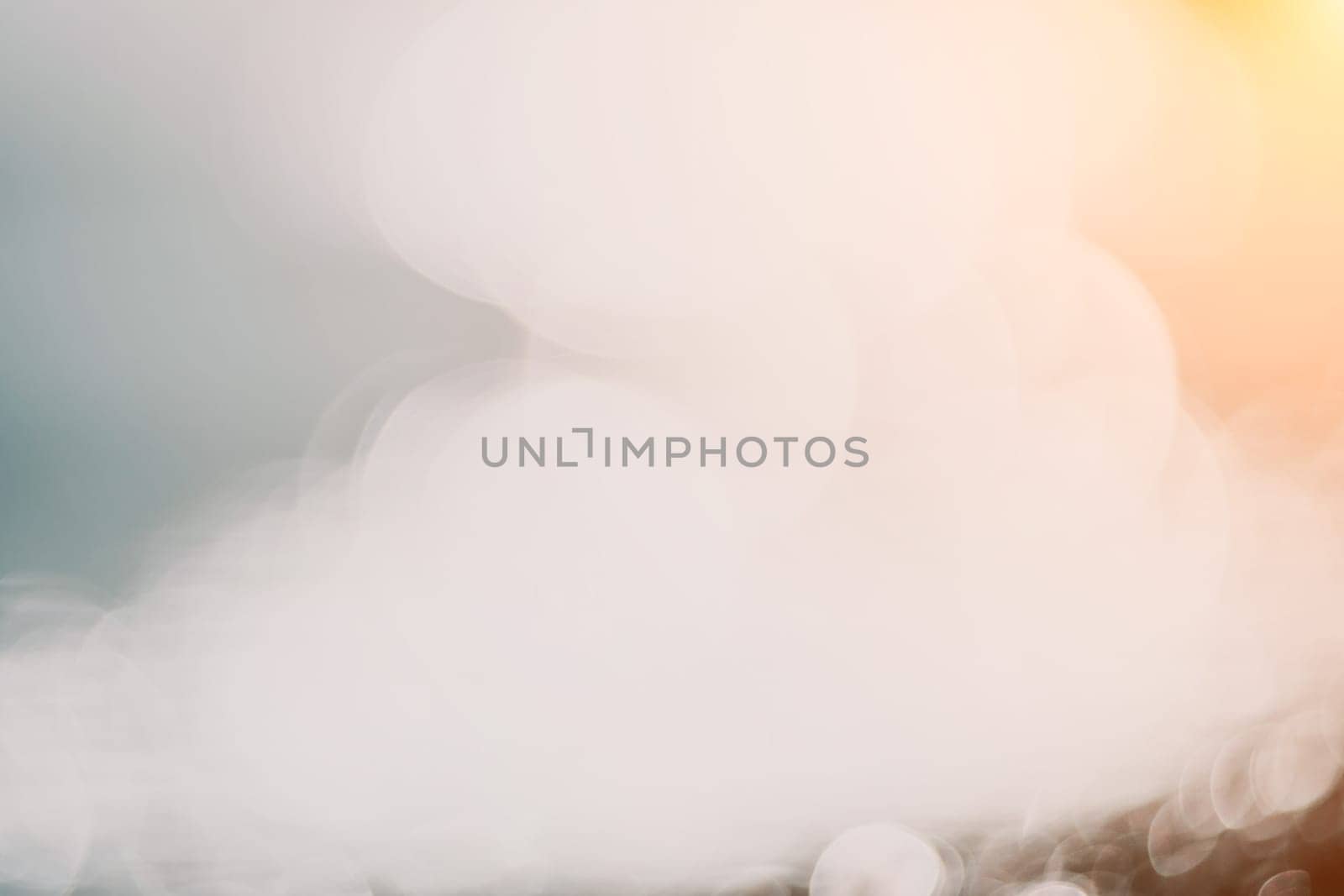Abstract nature summer ocean sunset sea background. Small waves on water surface in motion blur with bokeh lights from sunrise. Holiday, vacation and recreational background concept. by panophotograph