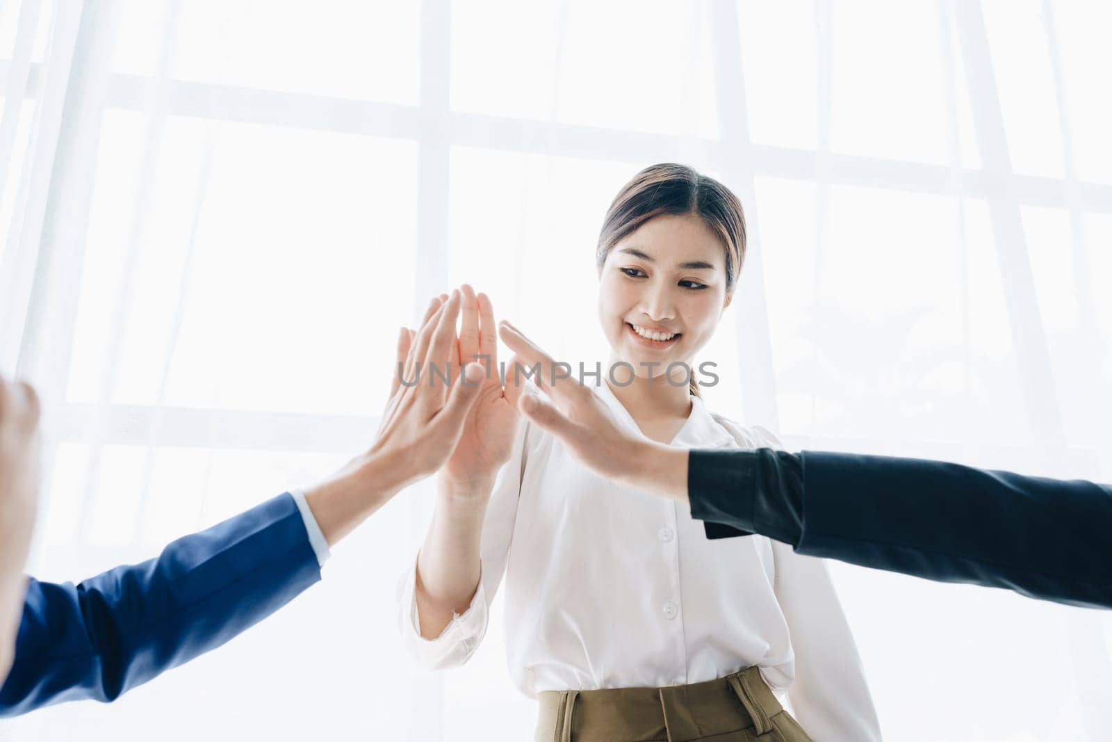 Business Success concept with partner, Partnership Giving Fist Bump after Complete a deal. Successful Teamwork, Businessman with Team Agreement in Corporate. by Manastrong