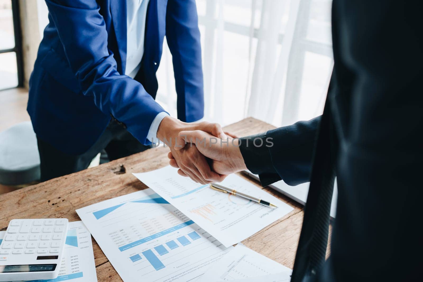 Young businesswoman and businessman collaborate with partners to increase their business investment network for Plans to improve quality next month in their office. agreement concept