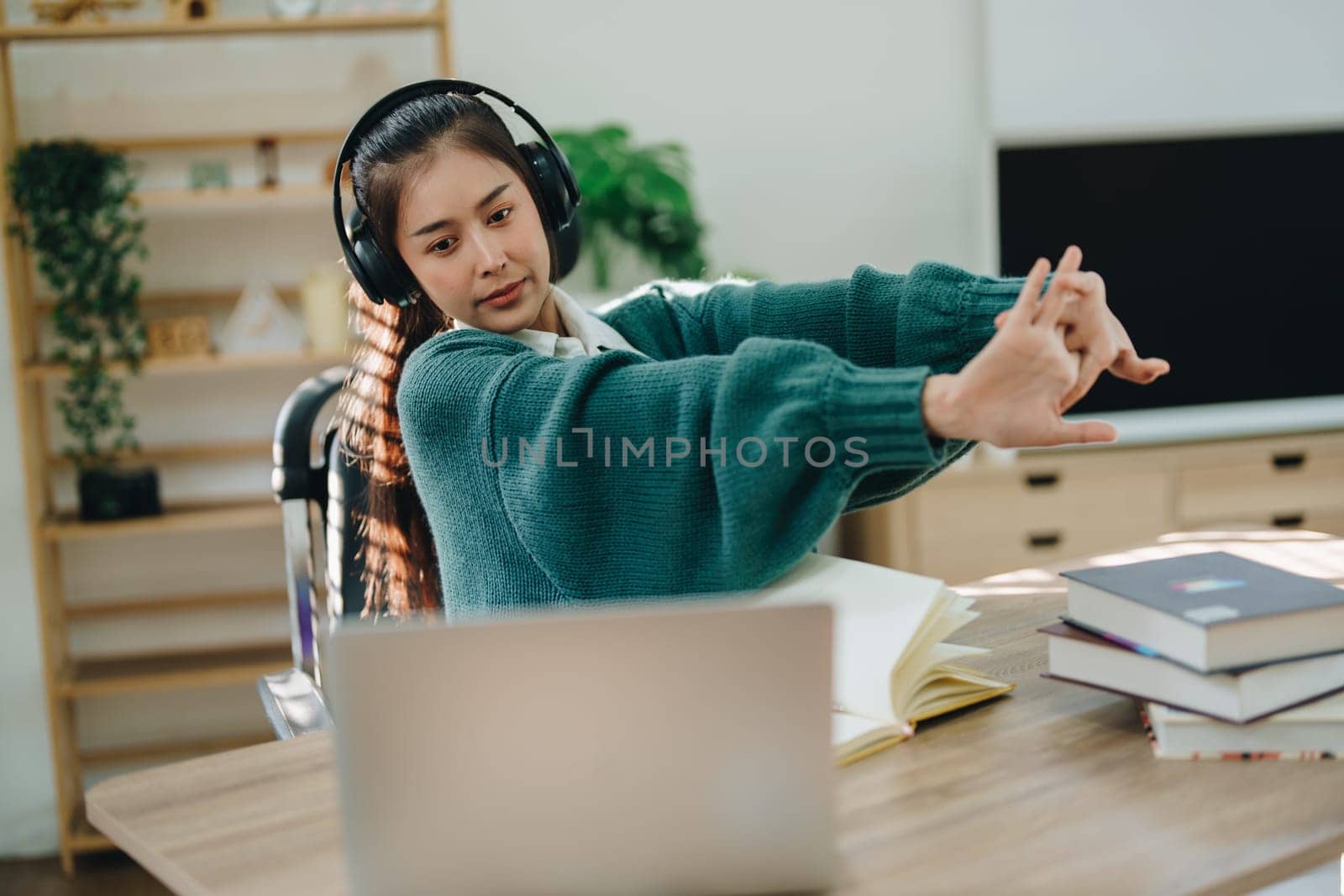 Studying online, beautiful Asian female student show symptoms burnout syndrome student studying online at home.