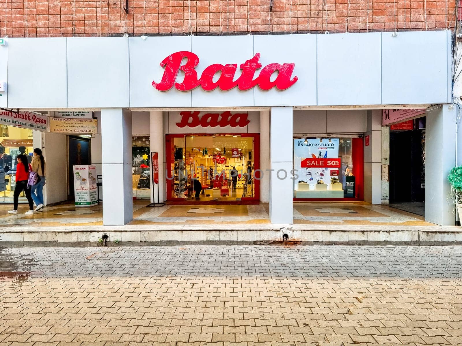 Delhi, India - 30th Dec 2022: Storefront with Bata branding showing the popular shoe, foot wear, fashion store offering affordable products