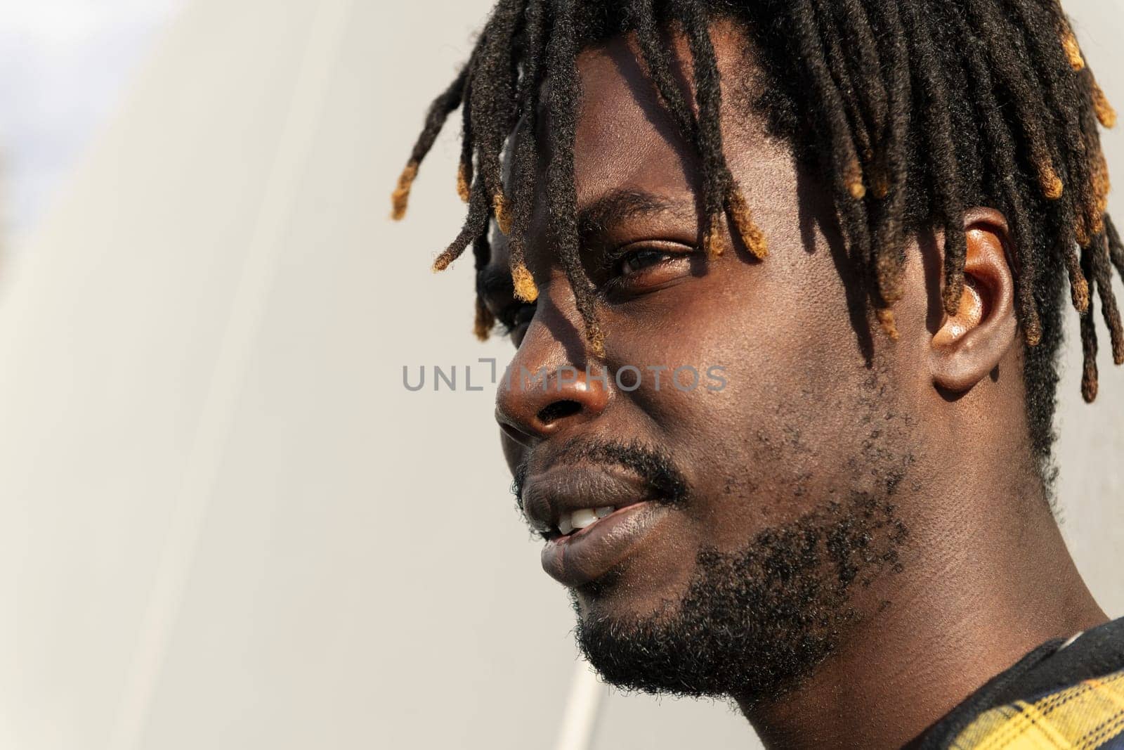 portrait of a young black african-american man, concept of lifestyle and cultural integration, copy space for text