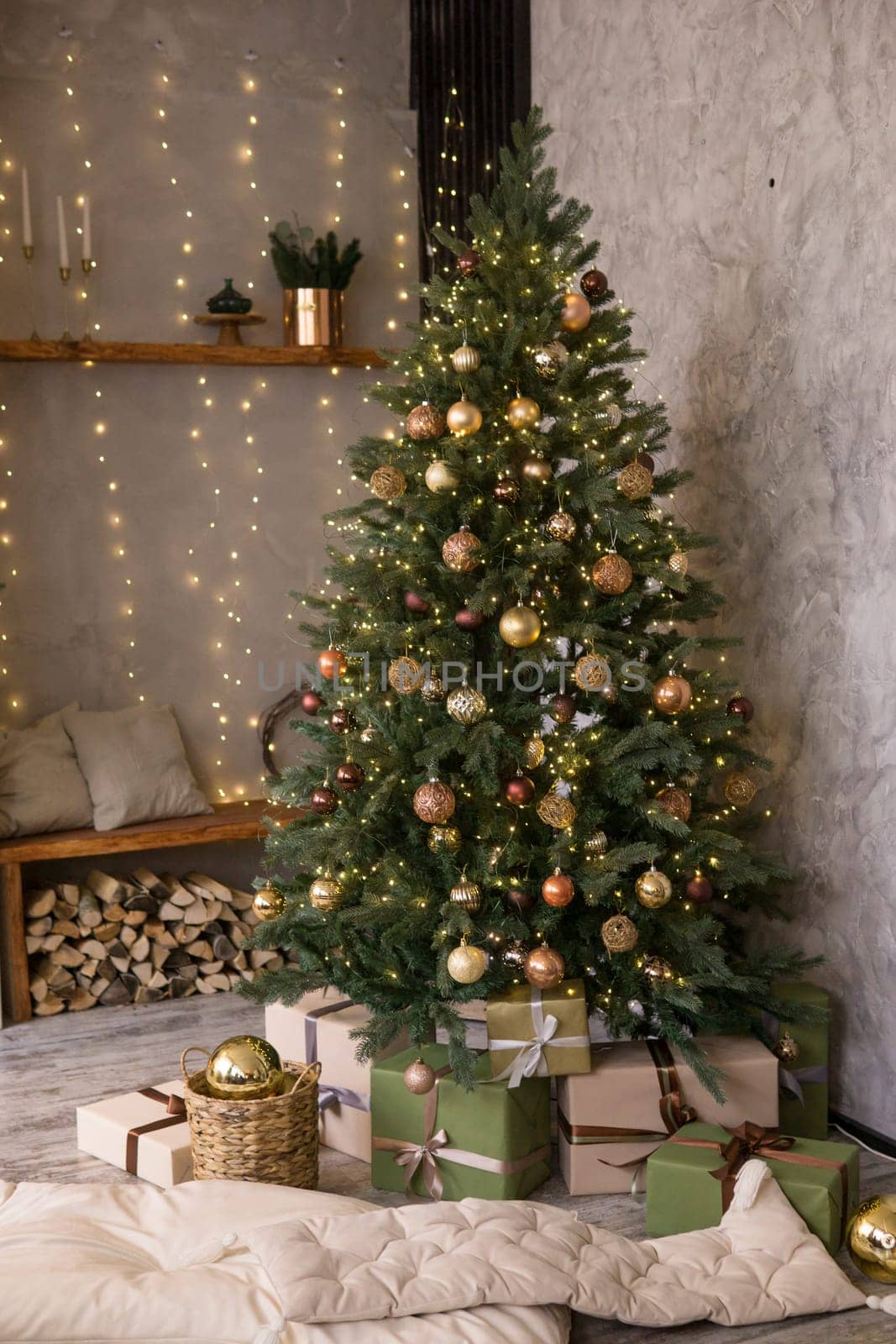 Home New Year's interior. Christmas tree with gifts, decorated with garlands. Cozy atmosphere of a home holiday, loft design of the room, Scandinavian style