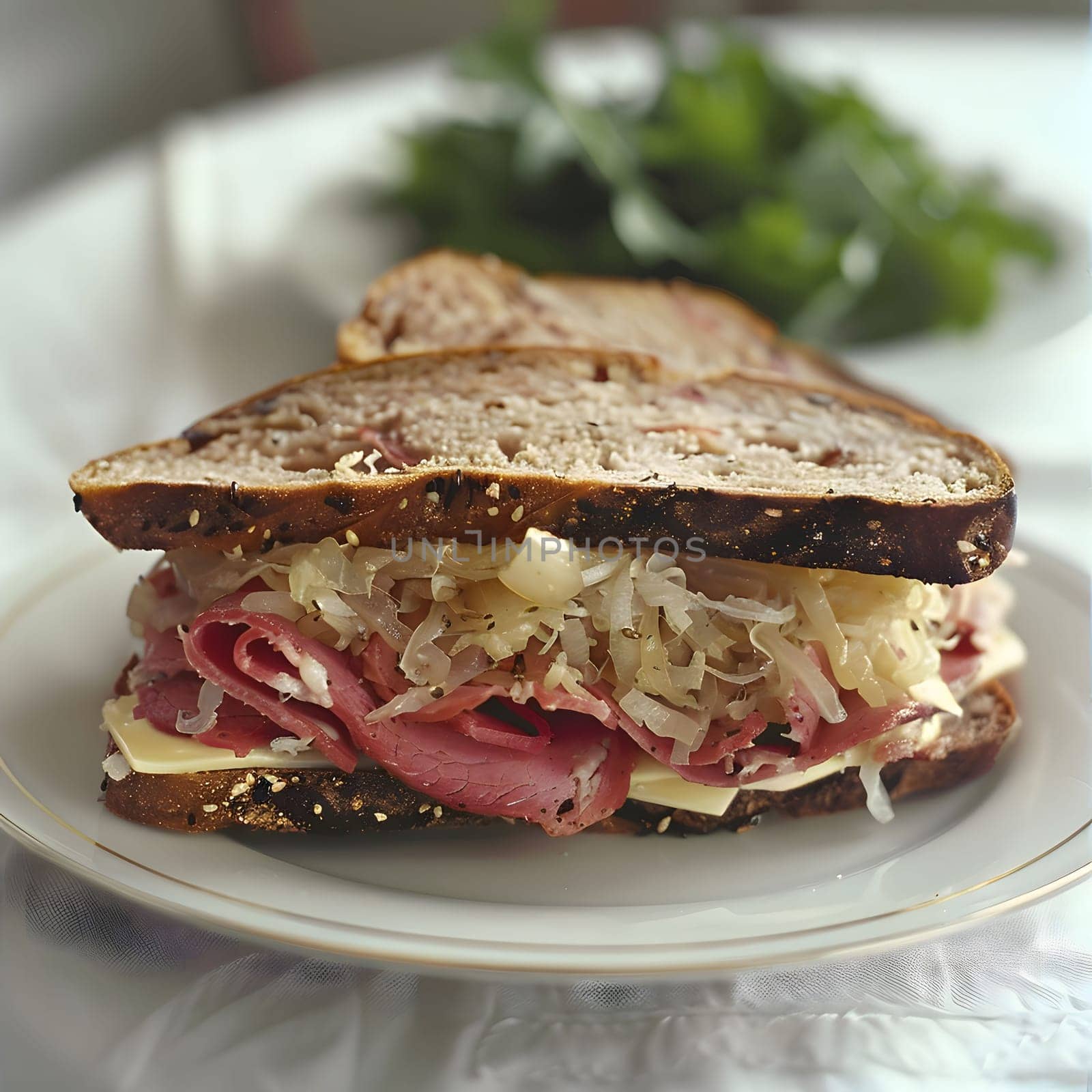 A close up shot of a delicious Reuben sandwich on a white plate. It is made with corned beef, sauerkraut, swiss cheese, and rye bread.