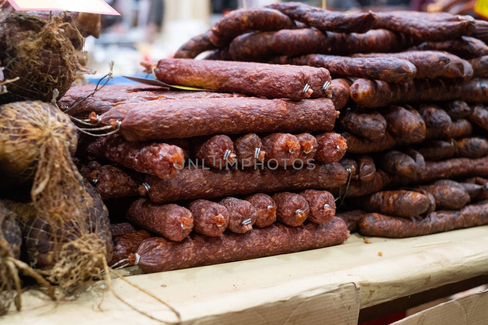 Smoked homemade sausages at the outdoors farmers market. close up view