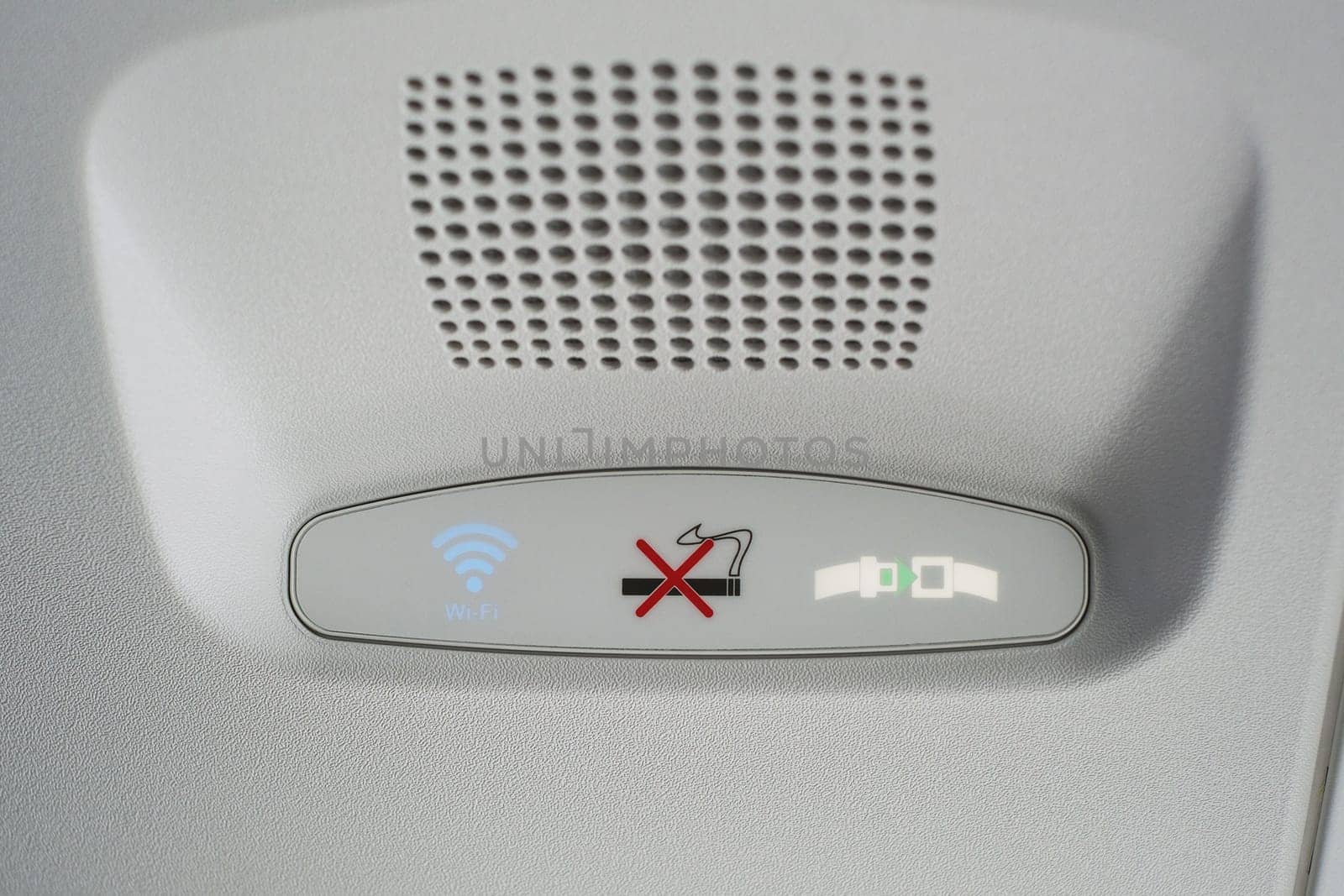 Group of Air control knobs in a new plane, Wi-Fi is included, light for belt warning signals and no smoking on the plane.