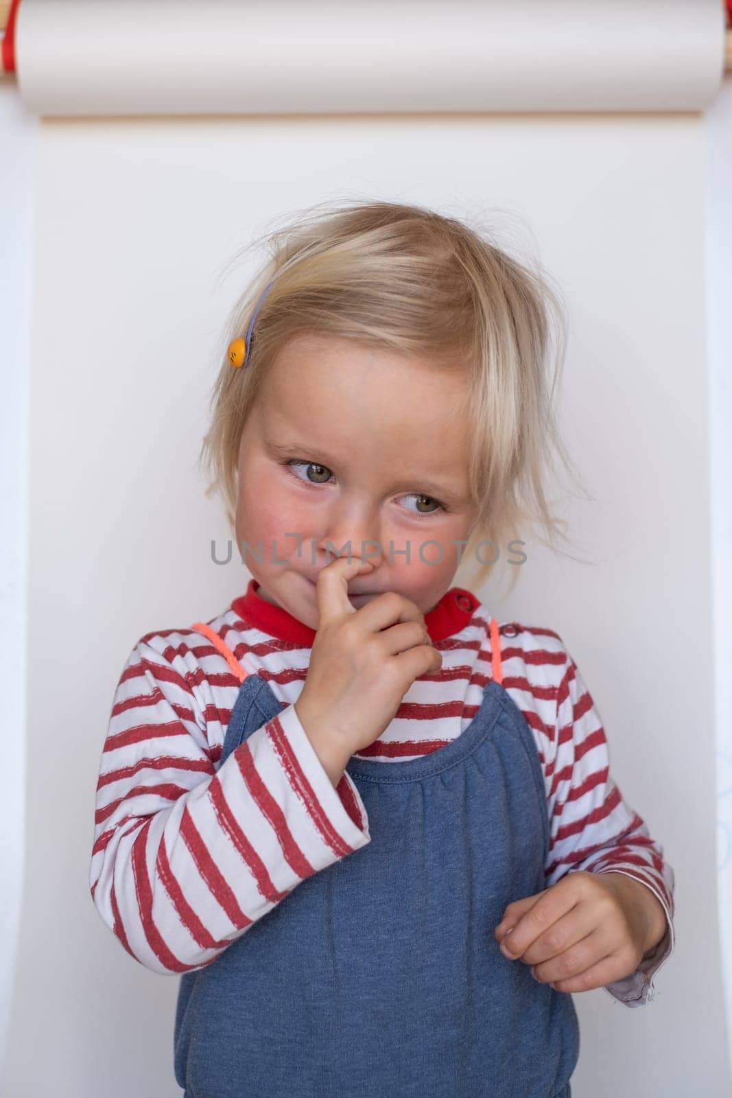 Beautiful happy caucasian toddler child girl smiling, portrait neutral background High quality photo