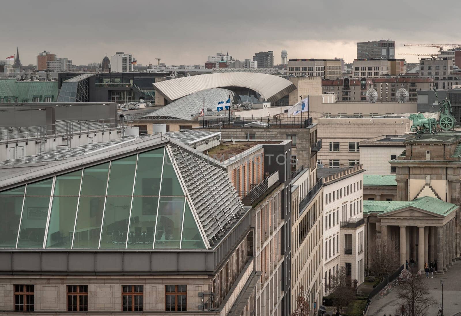 Berlin, Germany - Dec 20, 2023 - Berlin cityscape view from above of Reichstag building with the Brandenburg Gate and the Eberstrasse and buildings at the downtown Berlin. a major tourist attraction of the berlin city, Copy space, Selective focus.