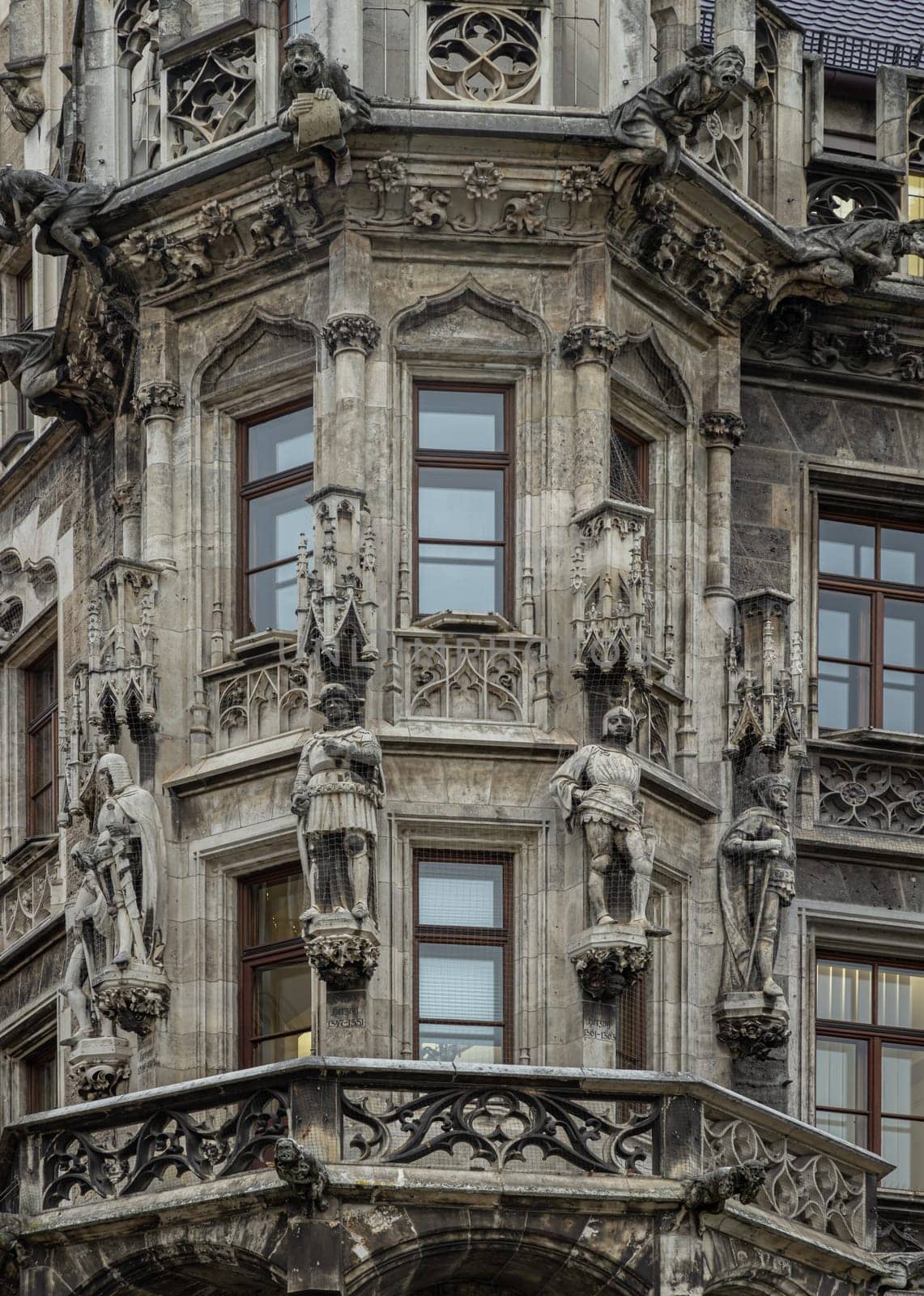 Munich, Germany - Dec 21, 2023 - Exterior architecture design details of famous New Town Hall (Neue Rathaus) on Marienplatz square in Munich. Gothic architectural style. Space for text, Selective focus.