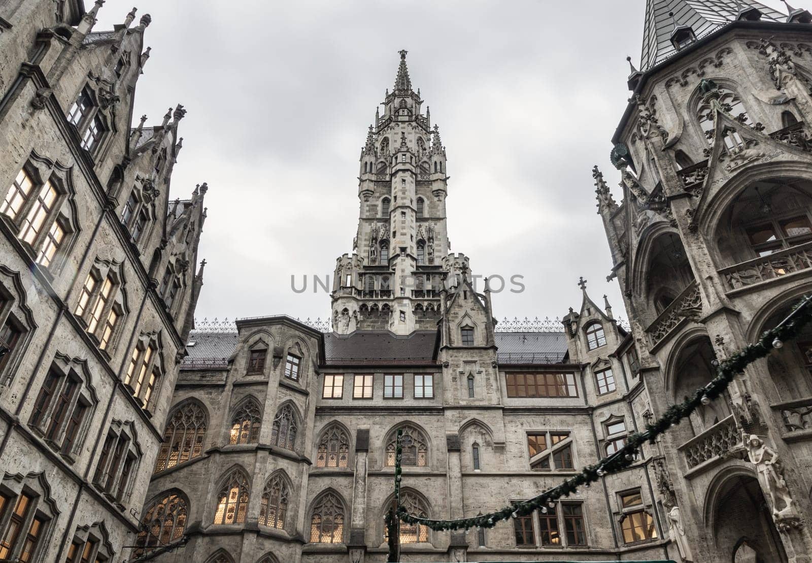 Munich, Germany - Dec 21, 2023 - Exterior architecture of famous New Town Hall (Neue Rathaus) on Marienplatz square in Munich. Gothic architectural style. Upper Bavaria, Copy space, Selective focus.