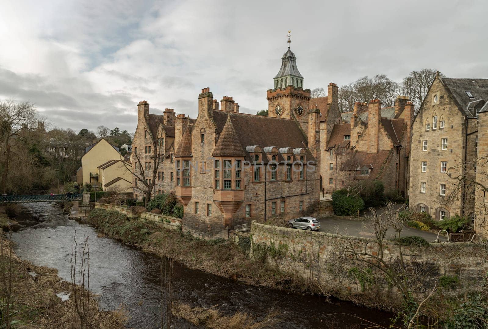 Edinburgh, Scotland - Jan 16, 2024 - Well Court is a traditional old Tenement building in Dean Village with river and stream which sits along the banks of the Water of Leith. Copy space, Selective focus.
