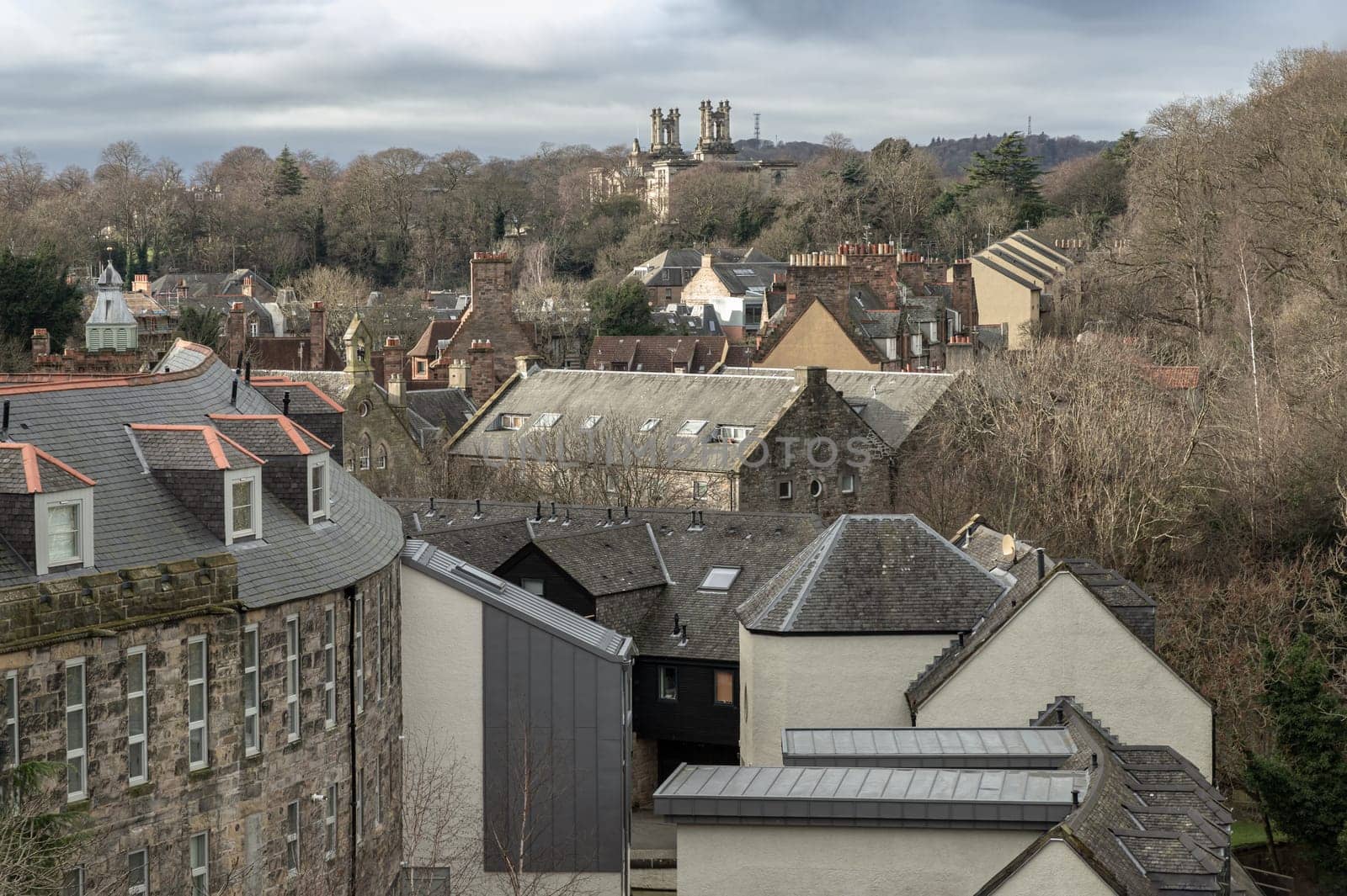 Edinburgh, Scotland - Jan 16, 2024 - Picturesque view of Dean Village on the Water and Leith with National galleries of scotland from the Dean Bridge. Historic village and Beautiful scenery view, Amazing Edinburgh cityscape, Destinations in Europe, Space for text, Selective focus.