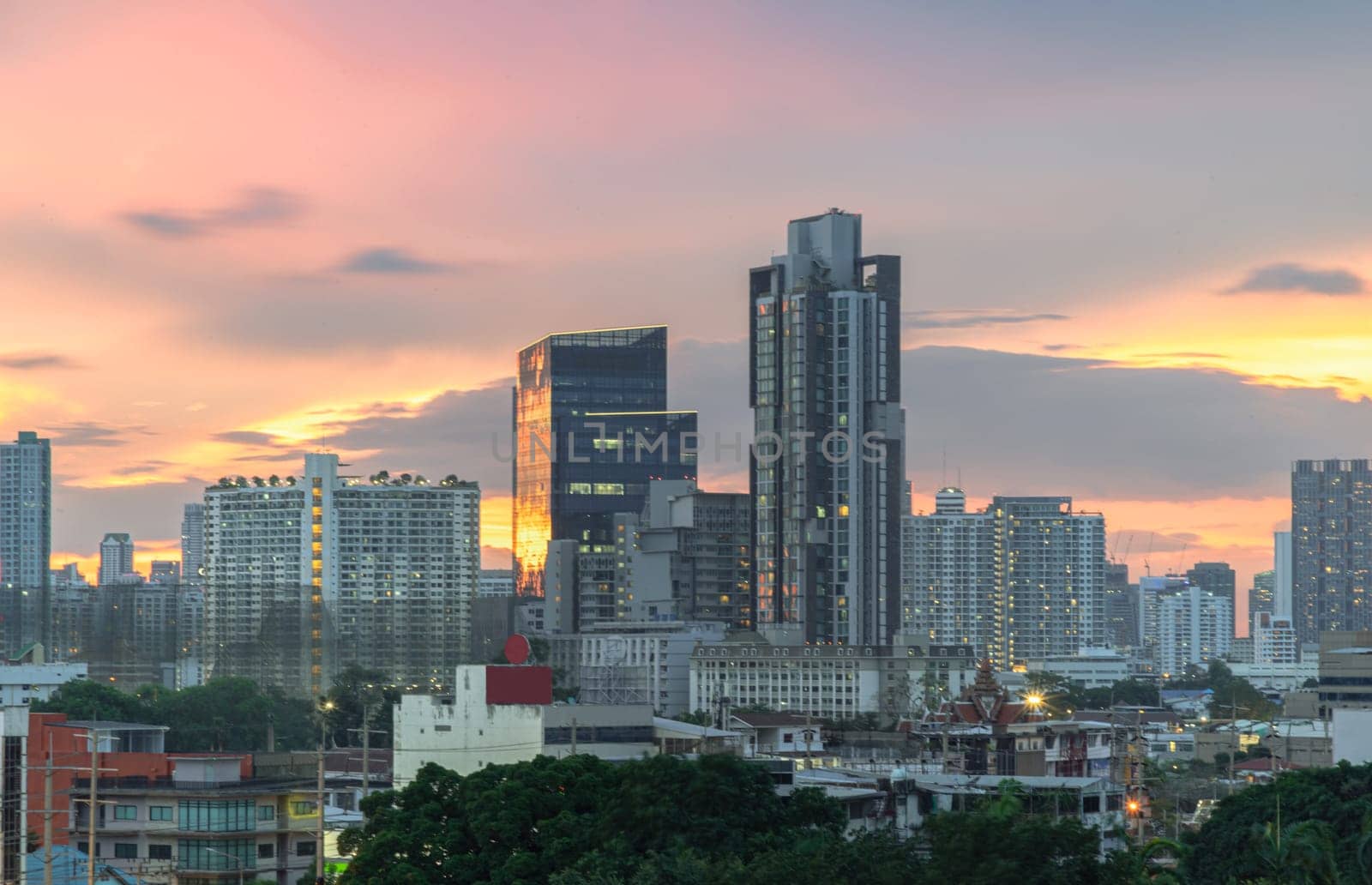 Bangkok, Thailand - May 20, 2024 - Bangkok city skyscrapers after sunset with Beautiful sky background. Gorgeous scenic of sunset with beautiful cloud and sky over metropolitan city, They can be used as Wallpaper, Space for text, Selective Focus.