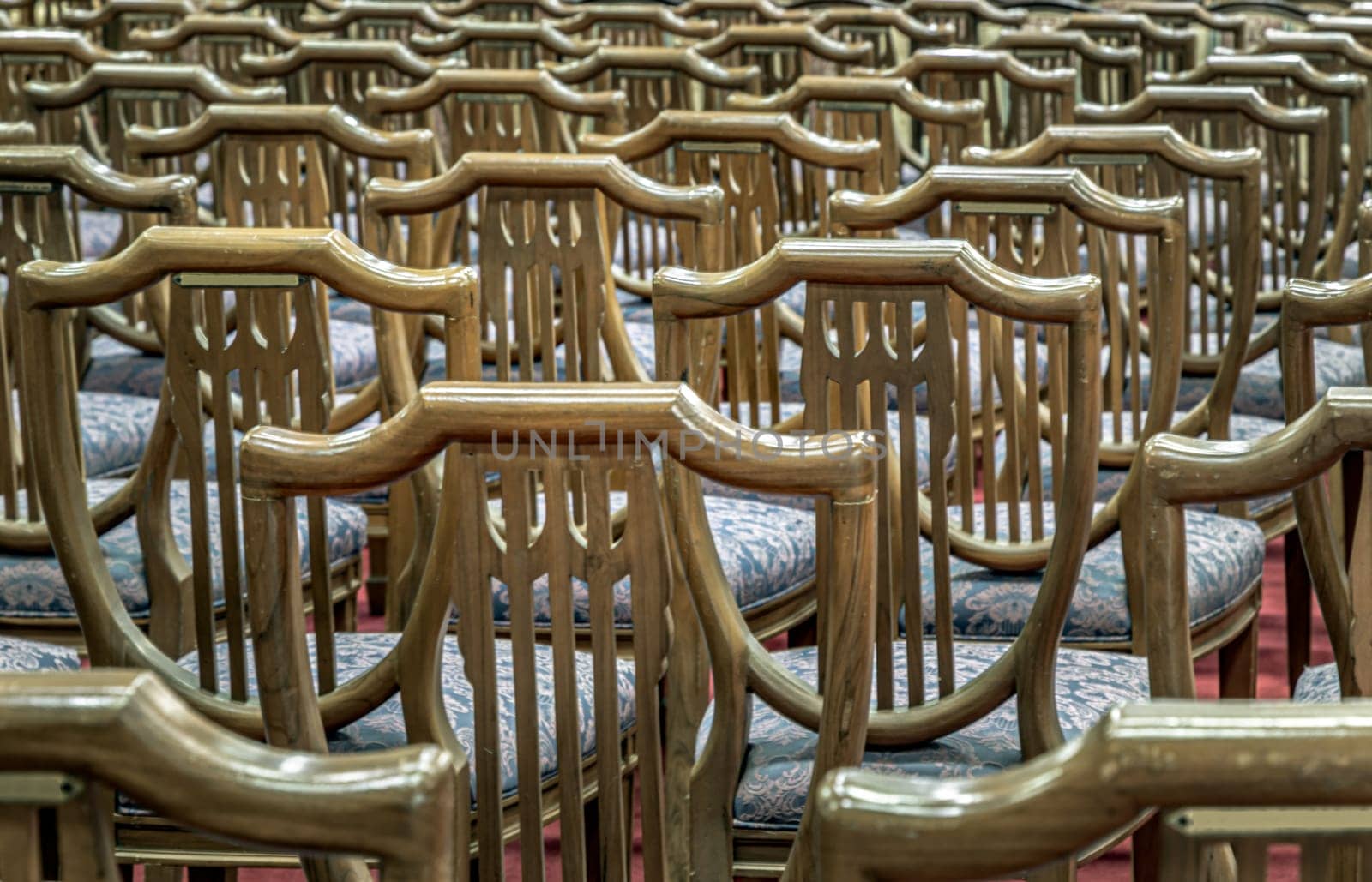 Bangkok, Thailand - May 22, 2024 - Chairs set for sitting within Samphanthawong Saram Worawihan temple. Space for text, Selective focus.