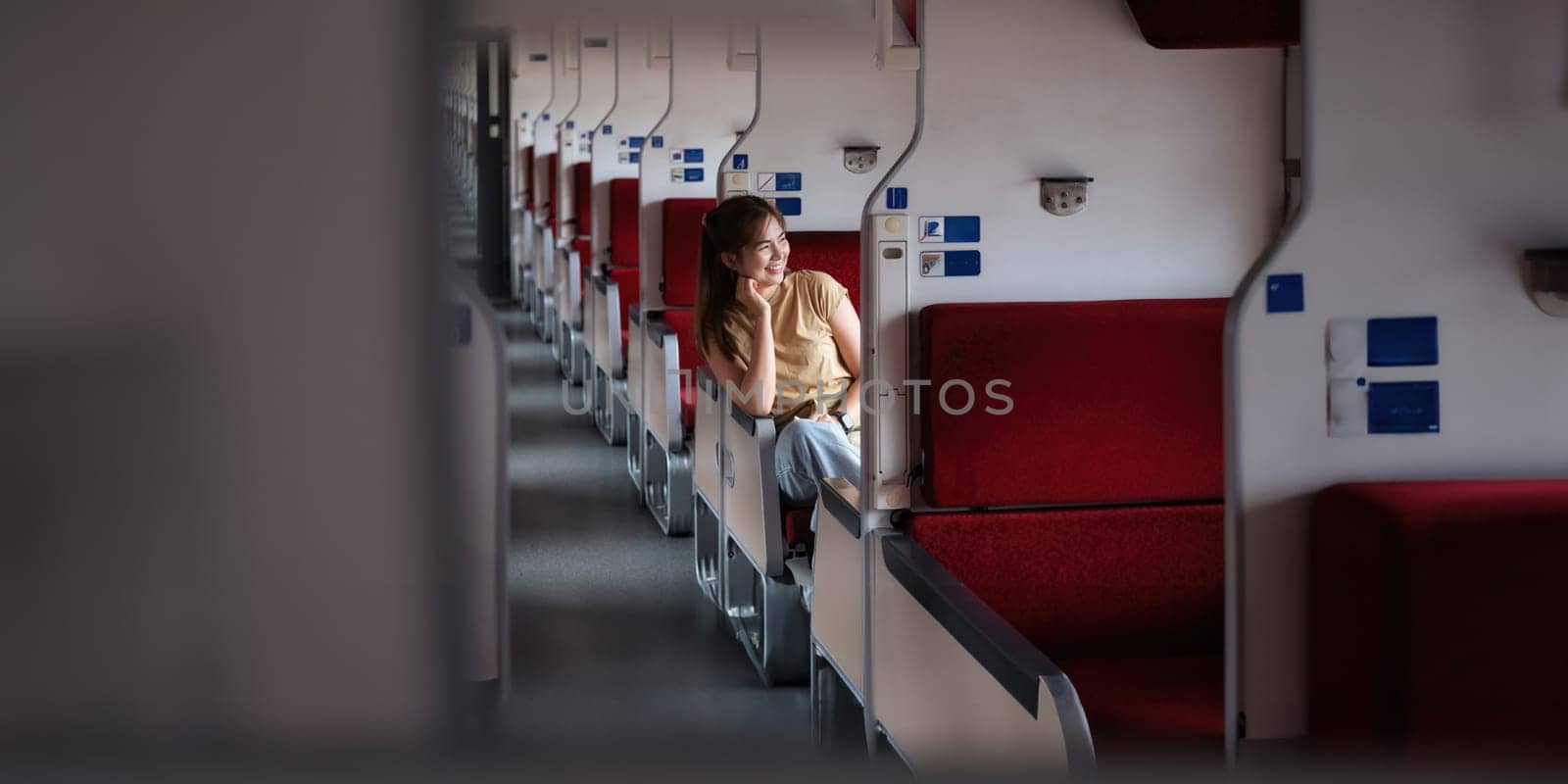 Traveler young woman travel in train on during sitting inside. travelling tourist have small trip fuji as the background concept transport lifestyle active journey and travel.