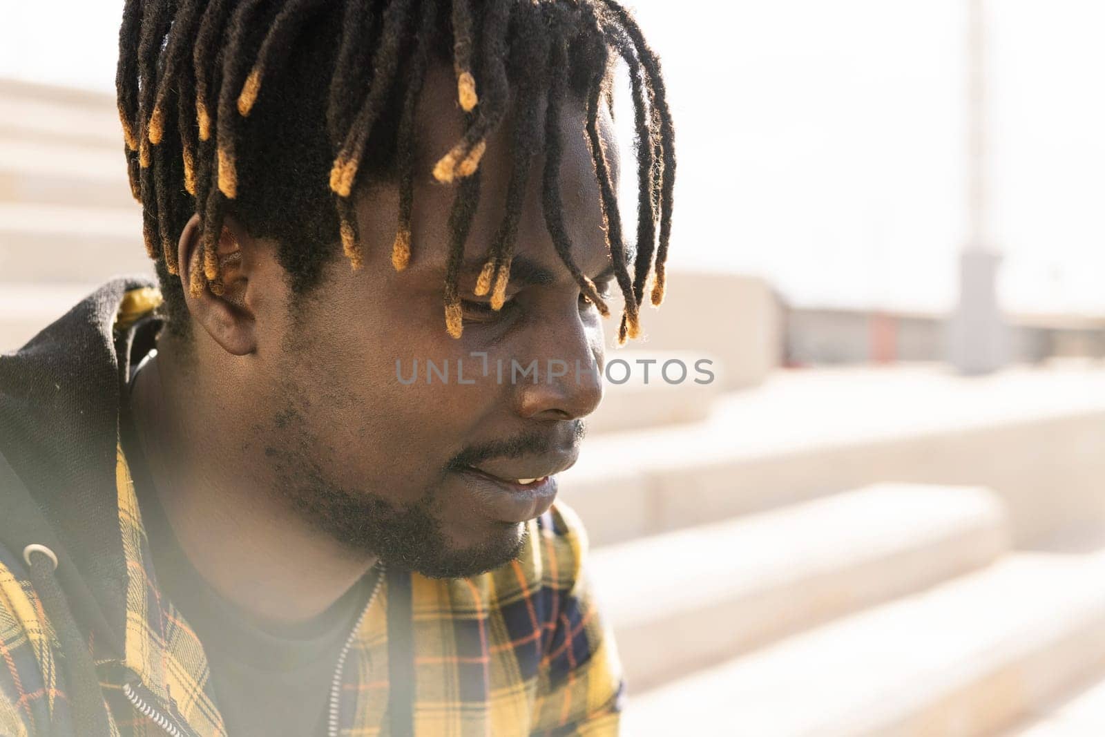 portrait of a young african-american man, concept of lifestyle and cultural integration, copy space for text