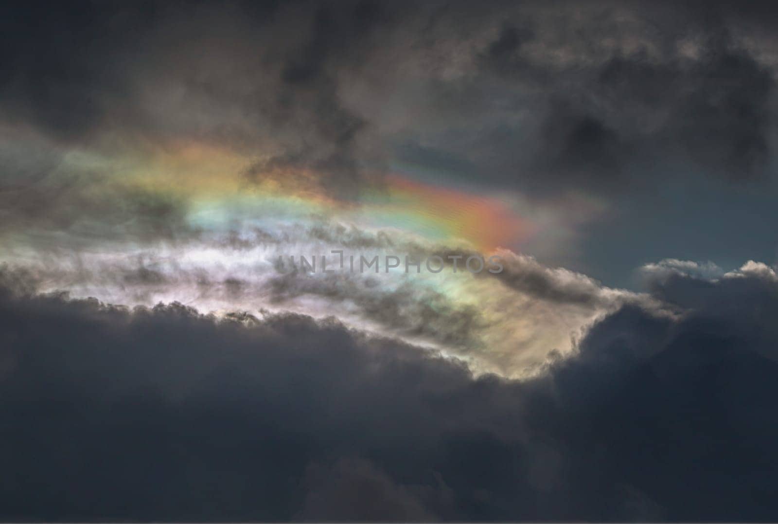 The sun's rays passing through the clouds and shining form an interesting light pattern against the sky. Amazing colors sky and clouds for background wallpaper and texture, Nature abstract composition, Selective focus.