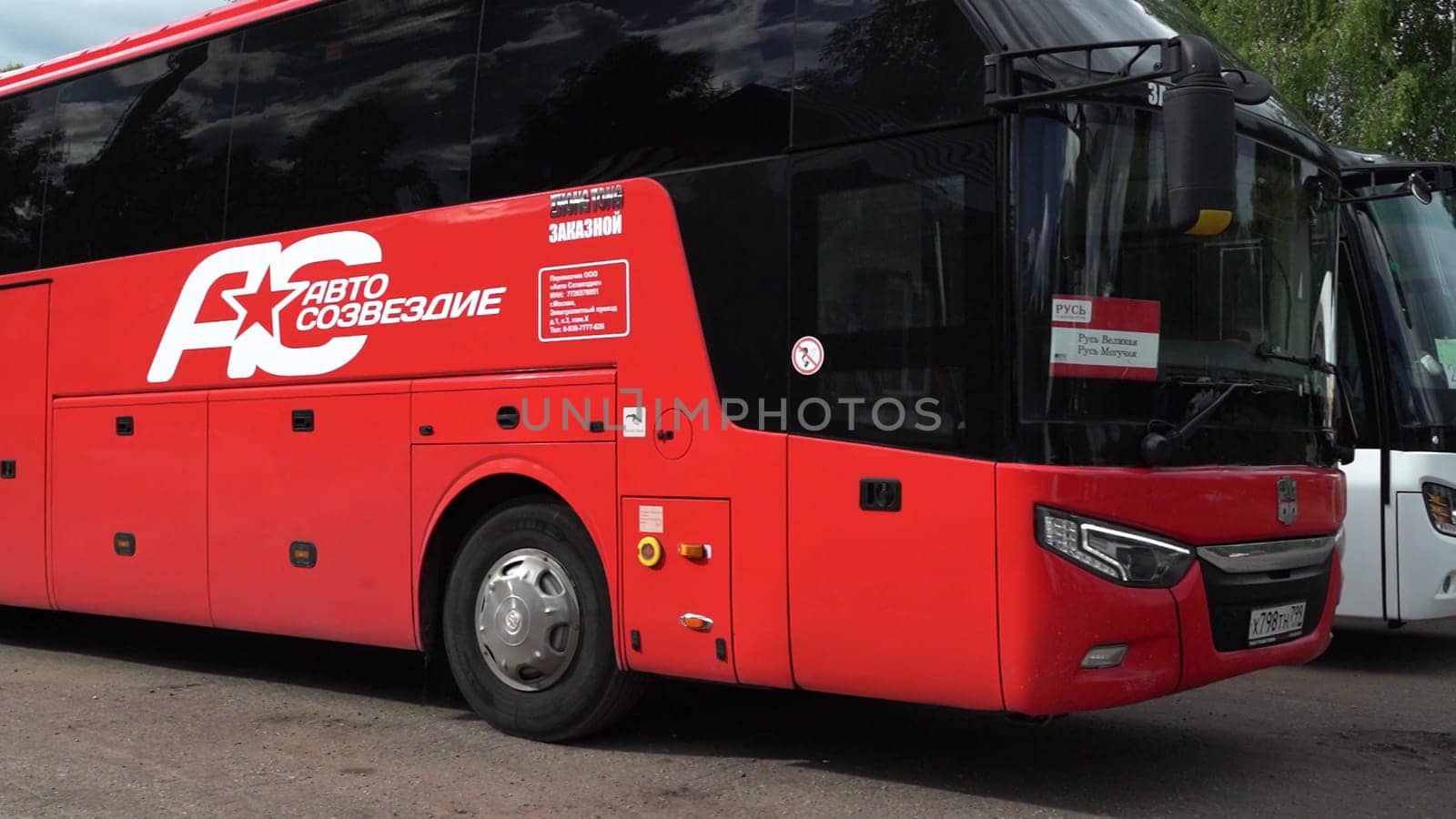 Russia, Pskov region, July 20, 2024 - A A close look at a red passenger bus parked in the station.