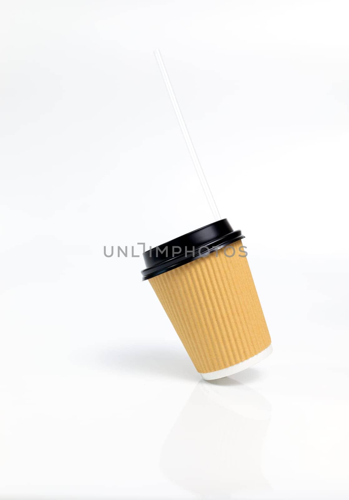 Levitating Isolated Brown Beige Paper Drinks Mug, Cup with Black Lid, Straw On White Background. Eco Hot Beverage Tumbler. On the Go Food Service Application. Vertical Plane, Copy Space