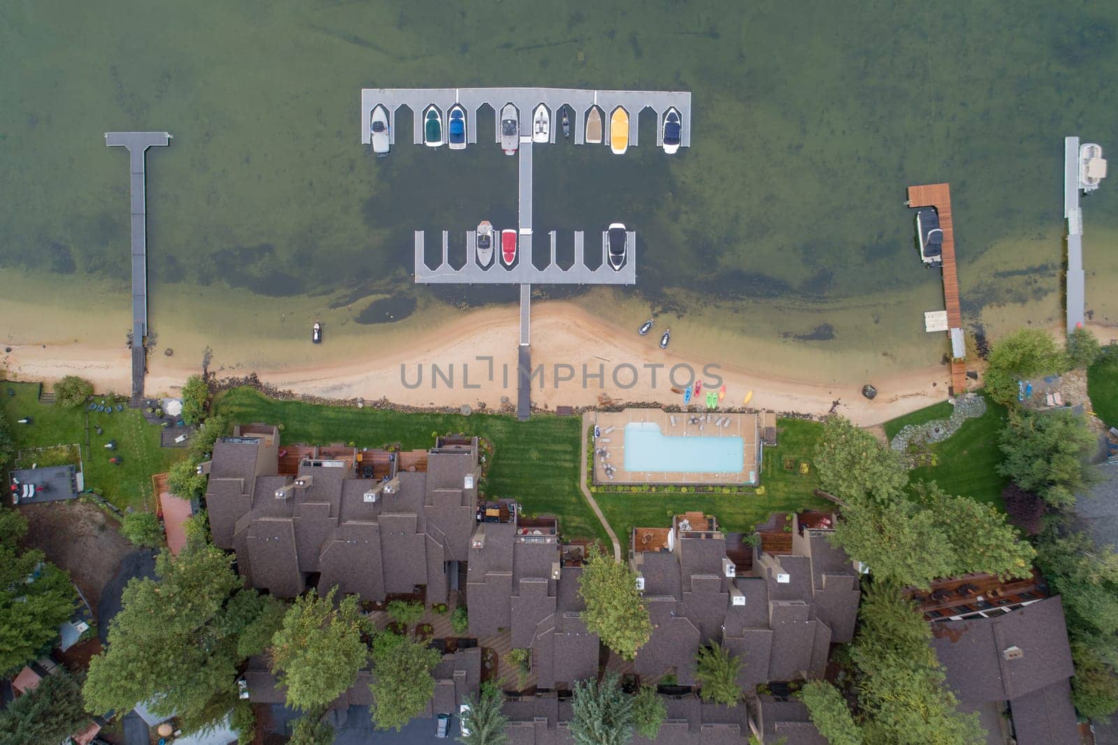 aerial view of a harbor in front of an apartment building