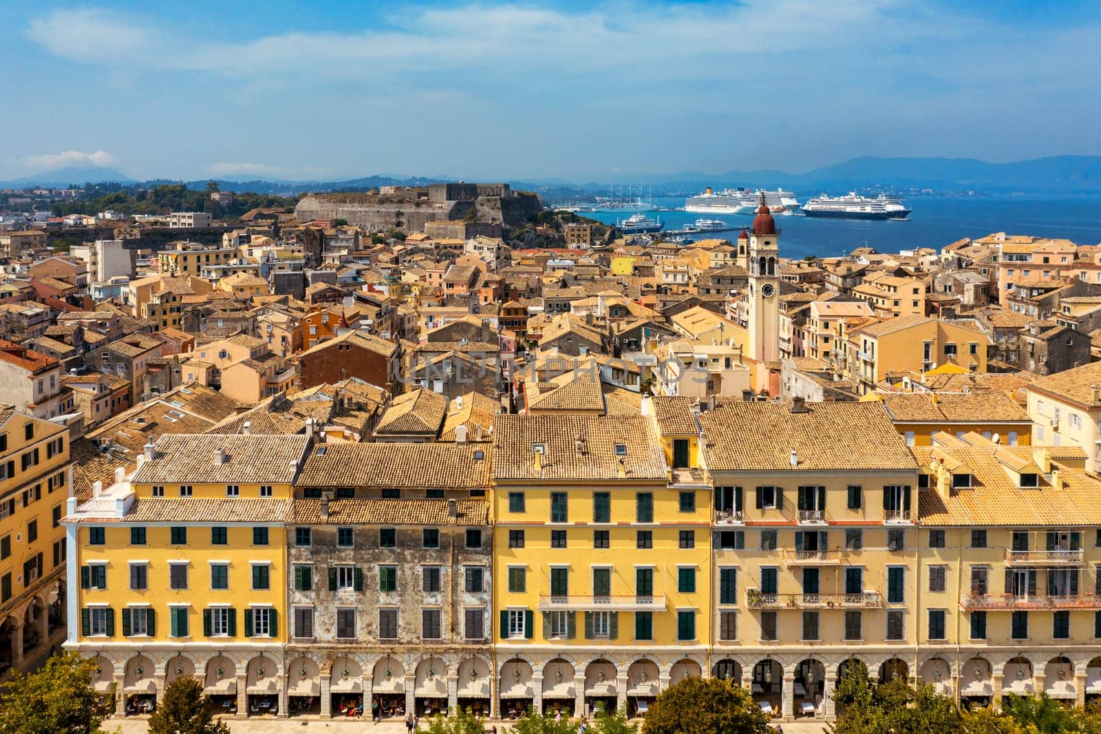 Panoramic view of Kerkyra, capital of Corfu island, Greece. Aerial drone view of Kerkyra with beautiful buildings during summer sunny day. Corfu island, Greece. 