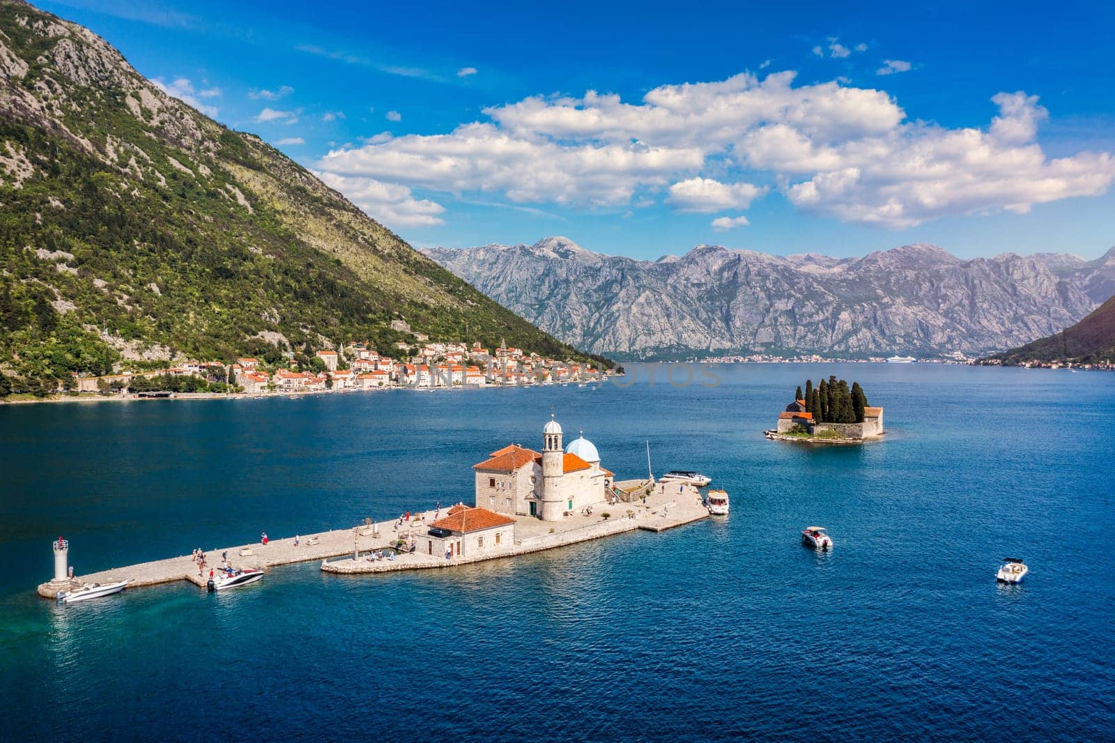 Saint George Island and Church of Our Lady of the Rocks in Perast, Montenegro. Our Lady of the Rock island and Church in Perast on shore of Boka Kotor bay (Boka Kotorska), Montenegro, Europe. 