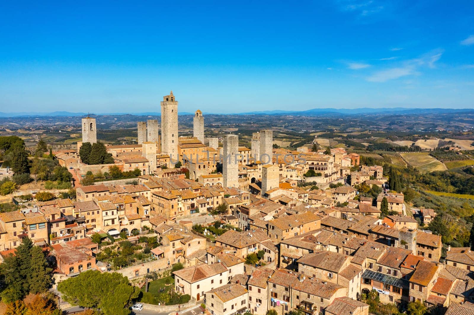 Town of San Gimignano, Tuscany, Italy with its famous medieval towers. Aerial view of the medieval village of San Gimignano, a Unesco World Heritage Site. Italy, Tuscany, Val d'Elsa.