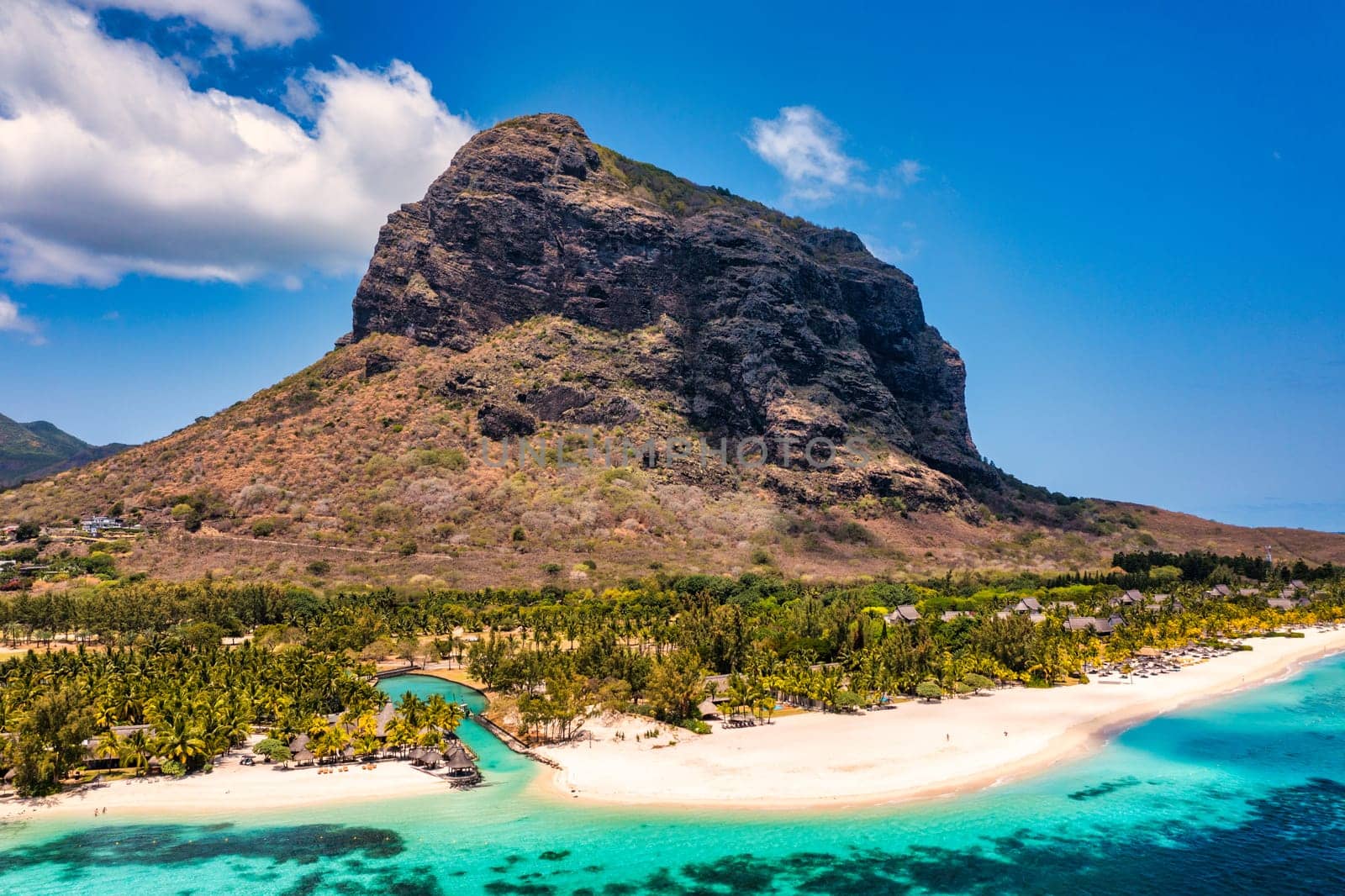 Tropical scenery, beautiful beaches of Mauritius island, Le Morne, popular luxury resort. Le Morne beach luxury resorts, Mauritius. Luxury beach in Mauritius, sandy beach with palms and blue ocean. 