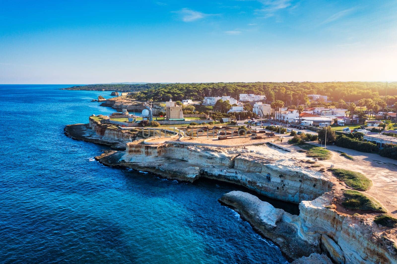 Stunning seascape with cliffs rocky arch and stacks (Faraglioni) at Torre Sant Andrea, Salento coast, Puglia region, Italy. Beautiful cliffs and sea stacks of Sant'Andrea, Salento, Apulia, Italy