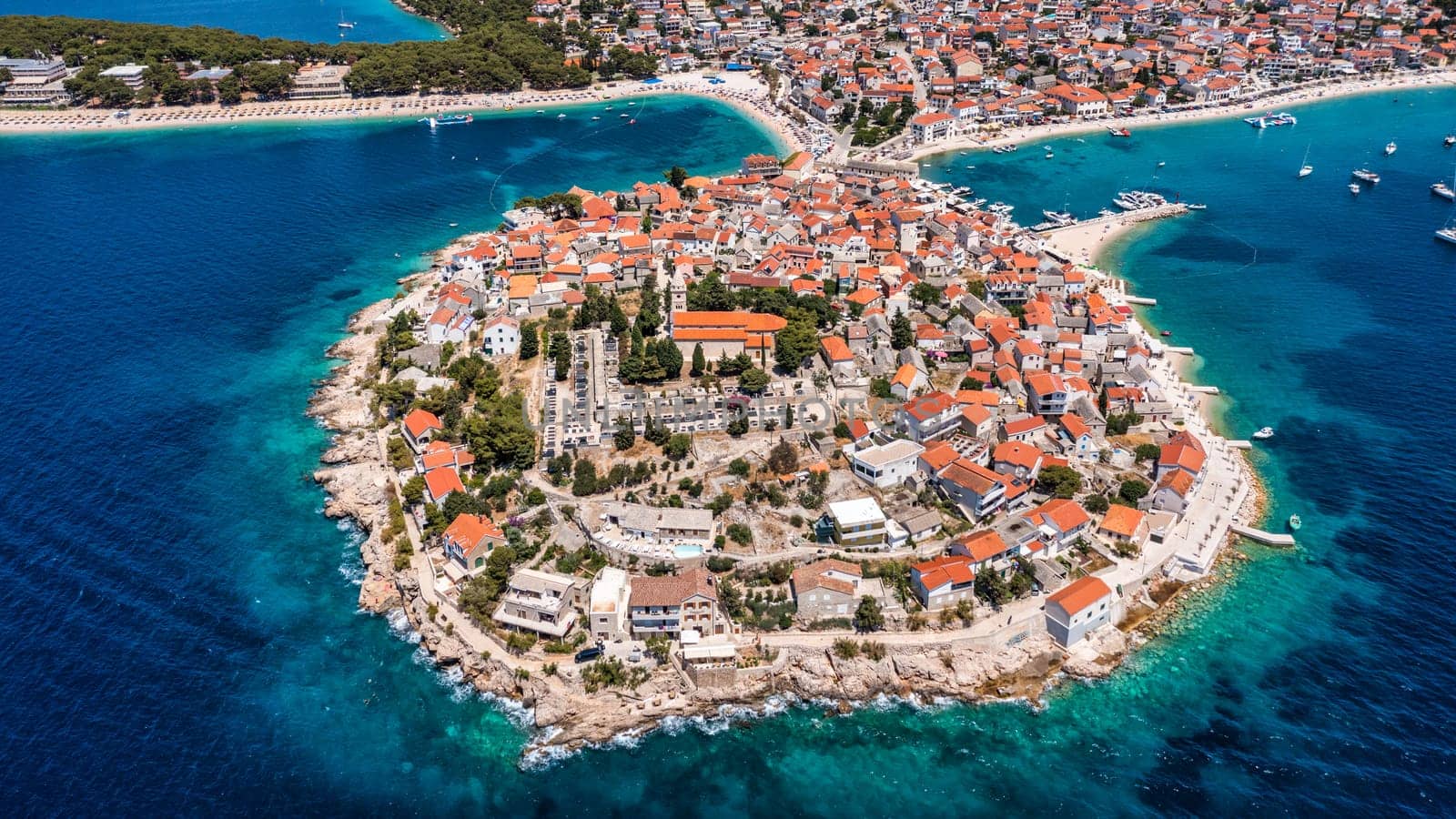 Aerial view of Primosten old town on the islet, Dalmatia, Croatia. Primosten, Sibenik Knin County, Croatia. Resort town on the Adriatic coast. Aerial view of adriatic town Primosten, Croatia
