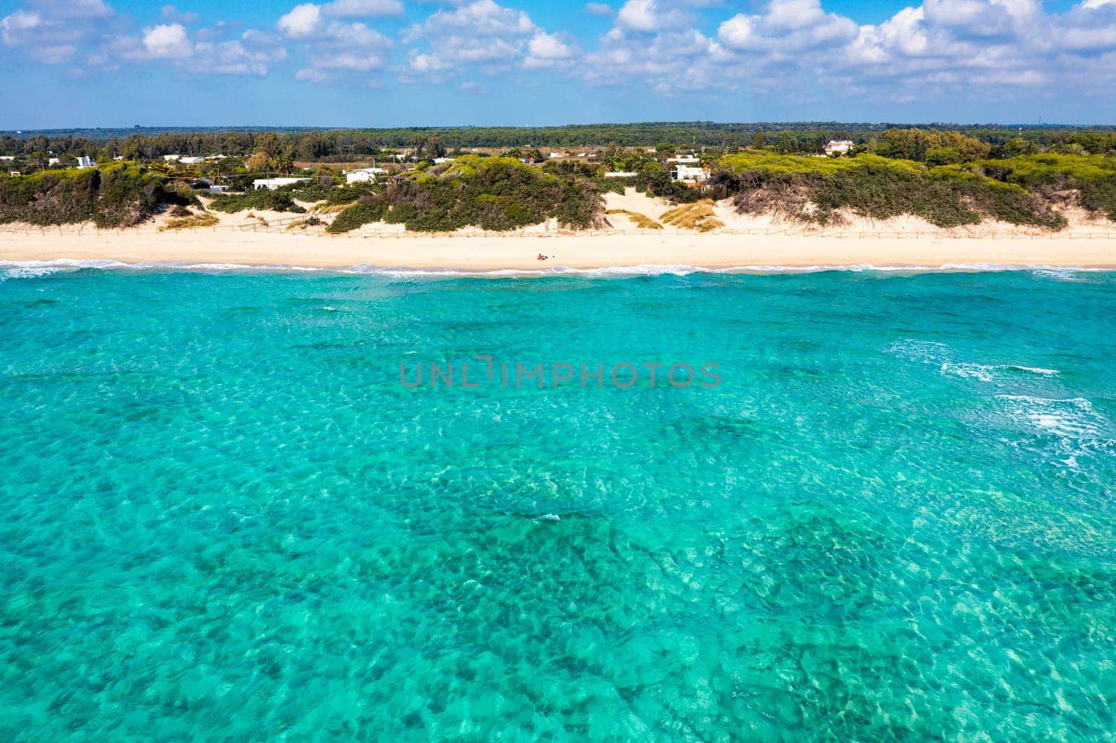 Punta Prosciutto azure sea water, crystal clear water on beach Punta Prosciutto, Italian Maldives Puglia Italy. Punta Prosciutto in Apulia, one of the most beautiful beaches of Italy.