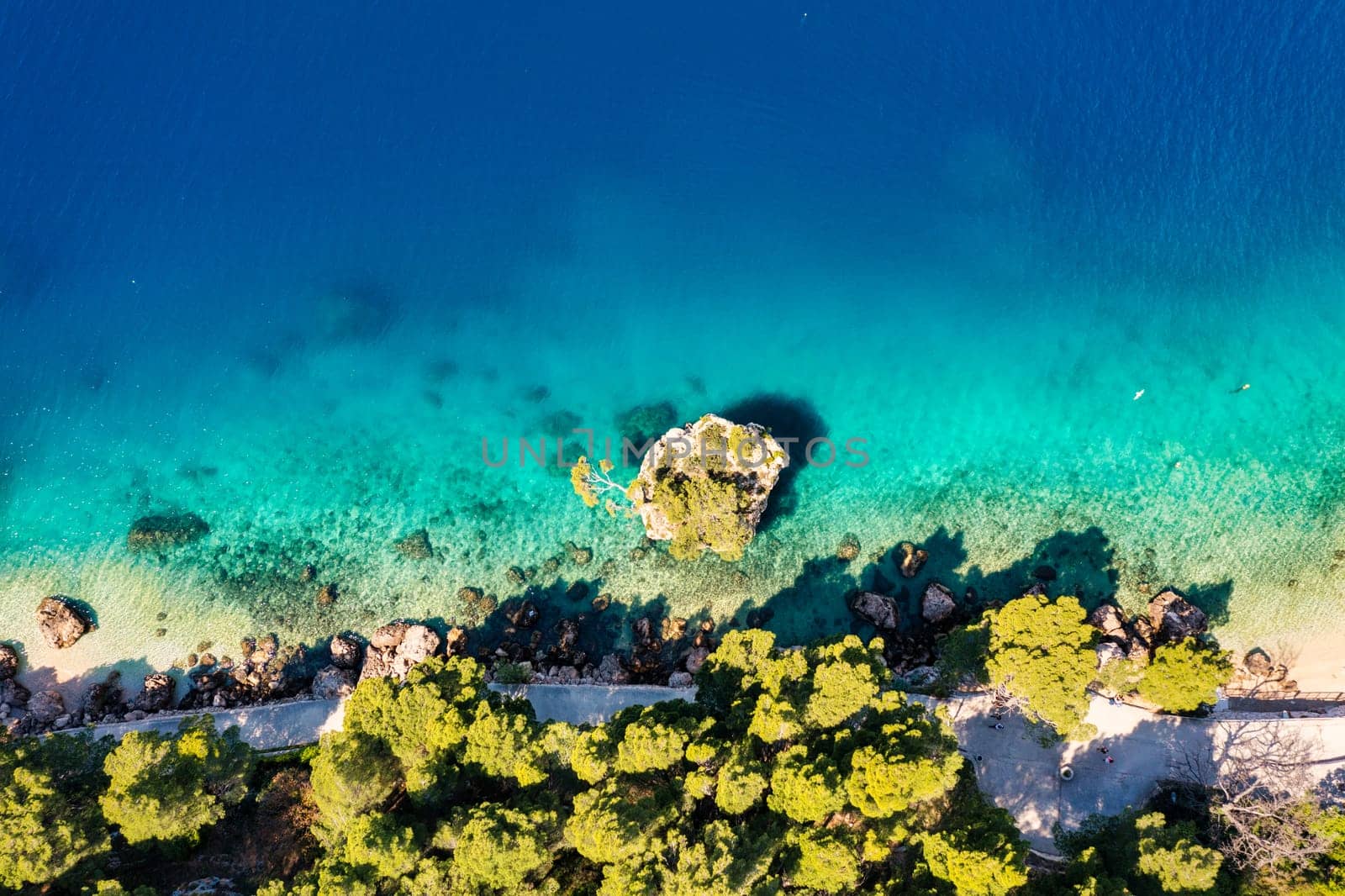 Kamen Brela symbol of the city of Brela on Adriatic coast of Dalmatia, Croatia. Kamen Brela, tiny famous island in Brela, Makarska Riviera, Dalmatia, Croatia.