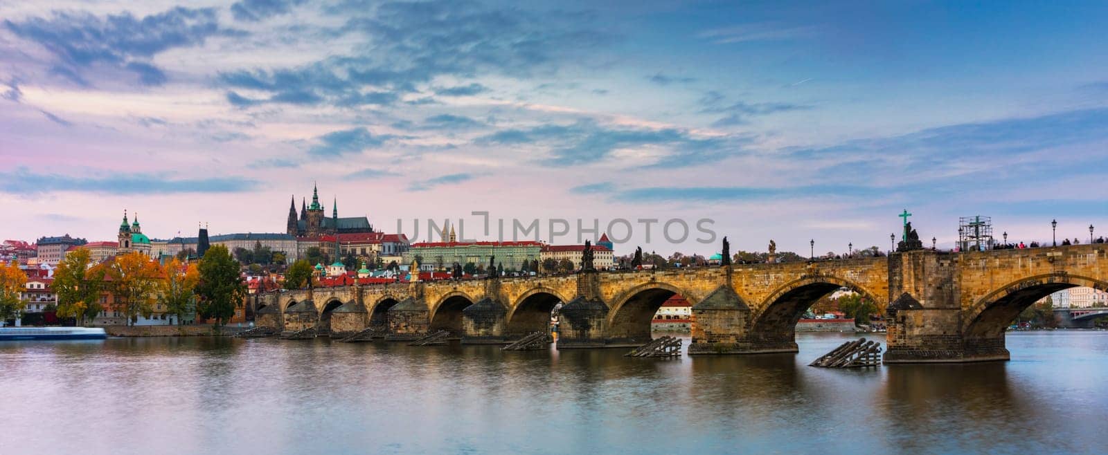 Charles Bridge in Prague in Czechia. Prague, Czech Republic. Charles Bridge (Karluv Most) and Old Town Tower. Vltava River and Charles Bridge. Concept of world travel, sightseeing and tourism.