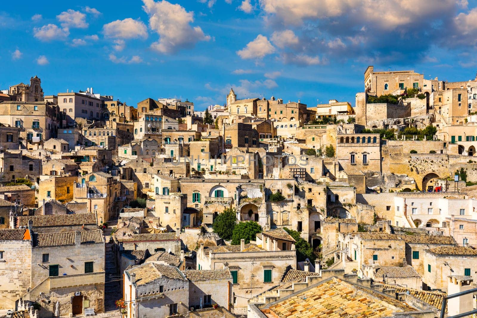 Panoramic view of the ancient town of Matera (Sassi di Matera) in a beautiful autumn day, Basilicata, southern Italy. Stunning view of the village of Matera. Matera is a city on a rocky outcrop.